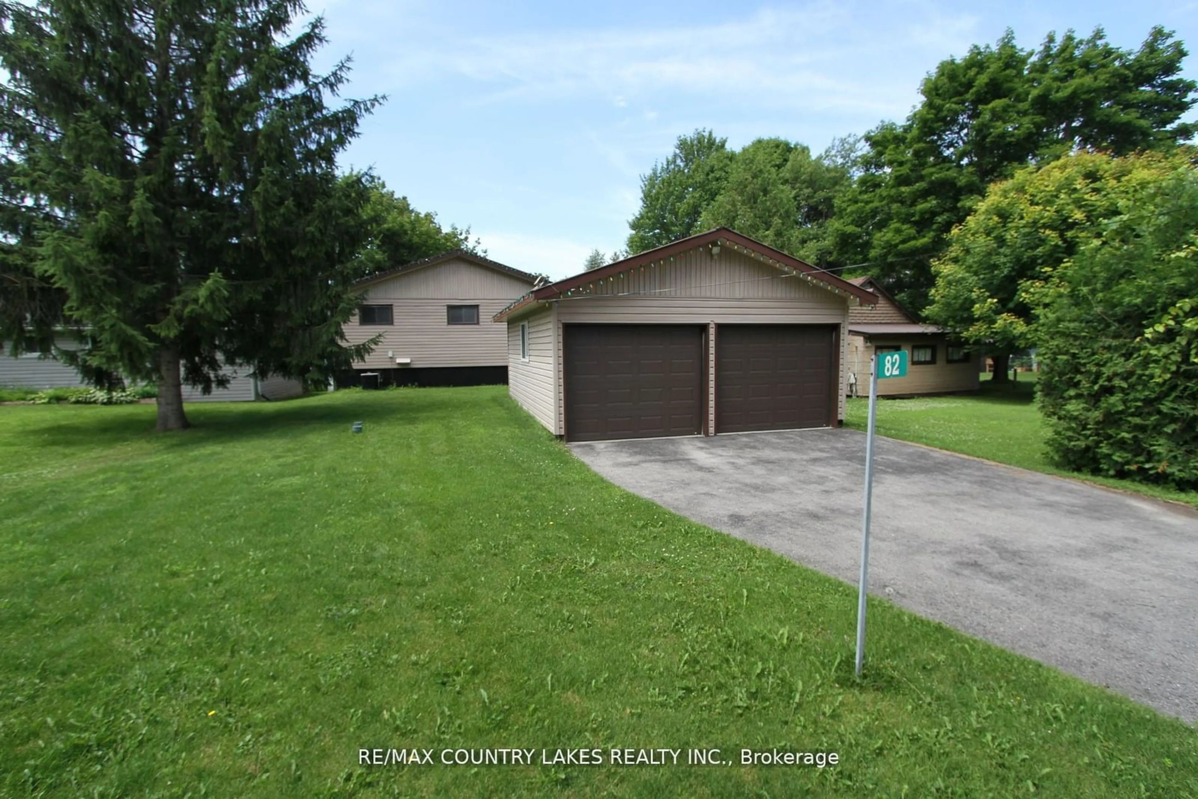 Frontside or backside of a home, the street view for 80-82 Antiquary Rd, Kawartha Lakes Ontario K0M 2B0