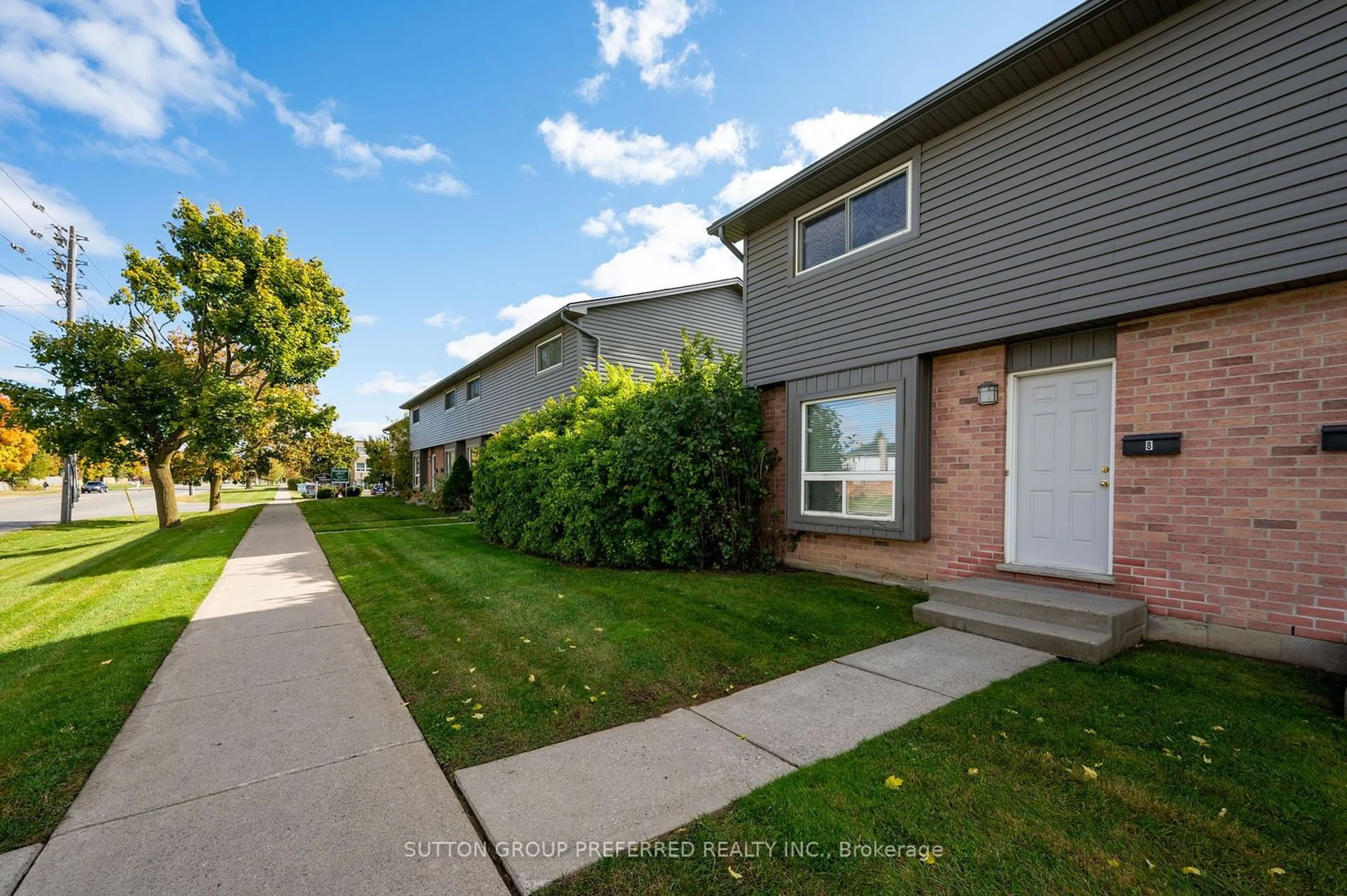 A pic from exterior of the house or condo, the fenced backyard for 1443 Huron St #8, London Ontario N5V 2E6