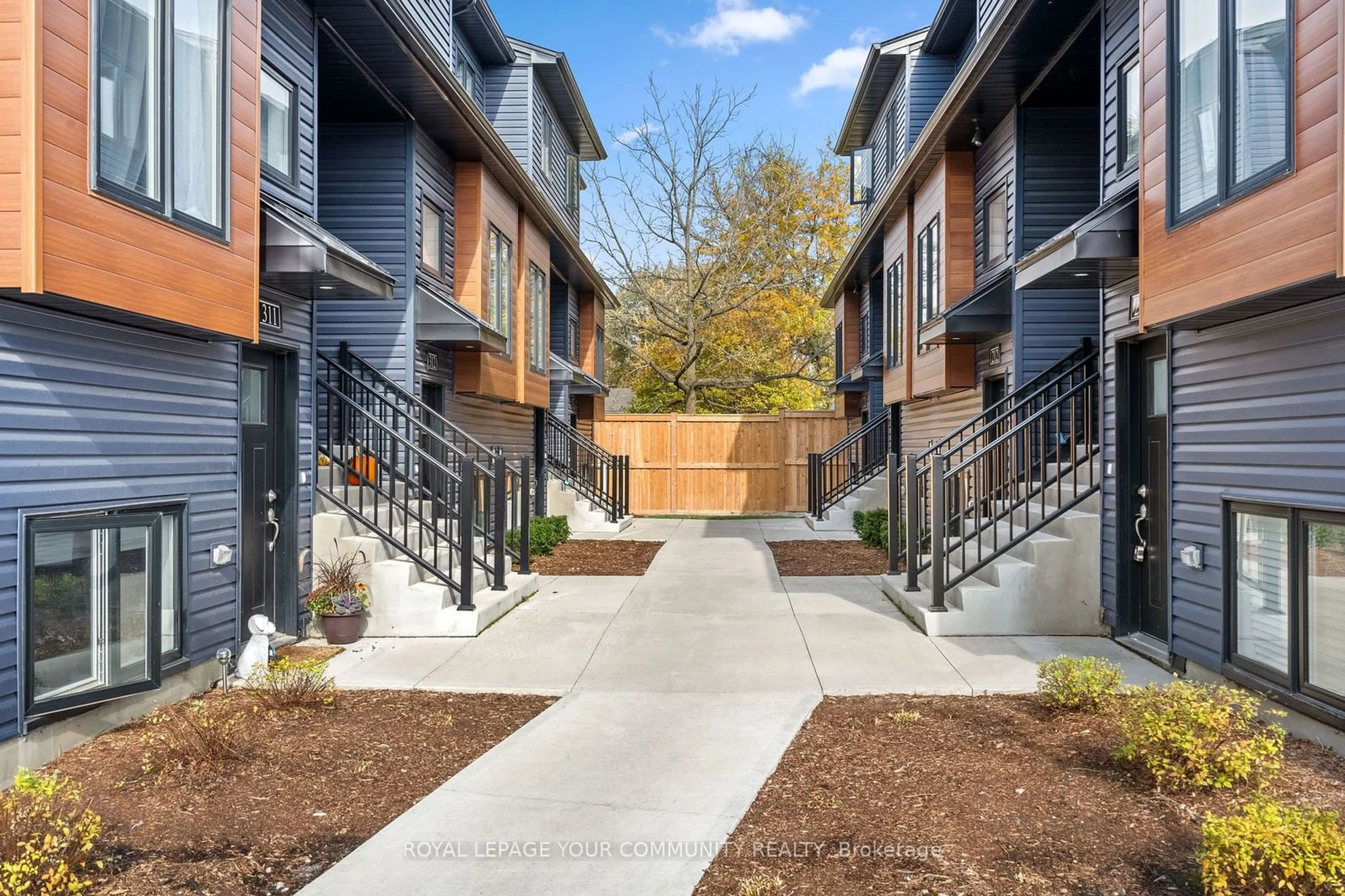 A pic from exterior of the house or condo, the fenced backyard for 781 Clare Ave #222, Welland Ontario L3C 0K1