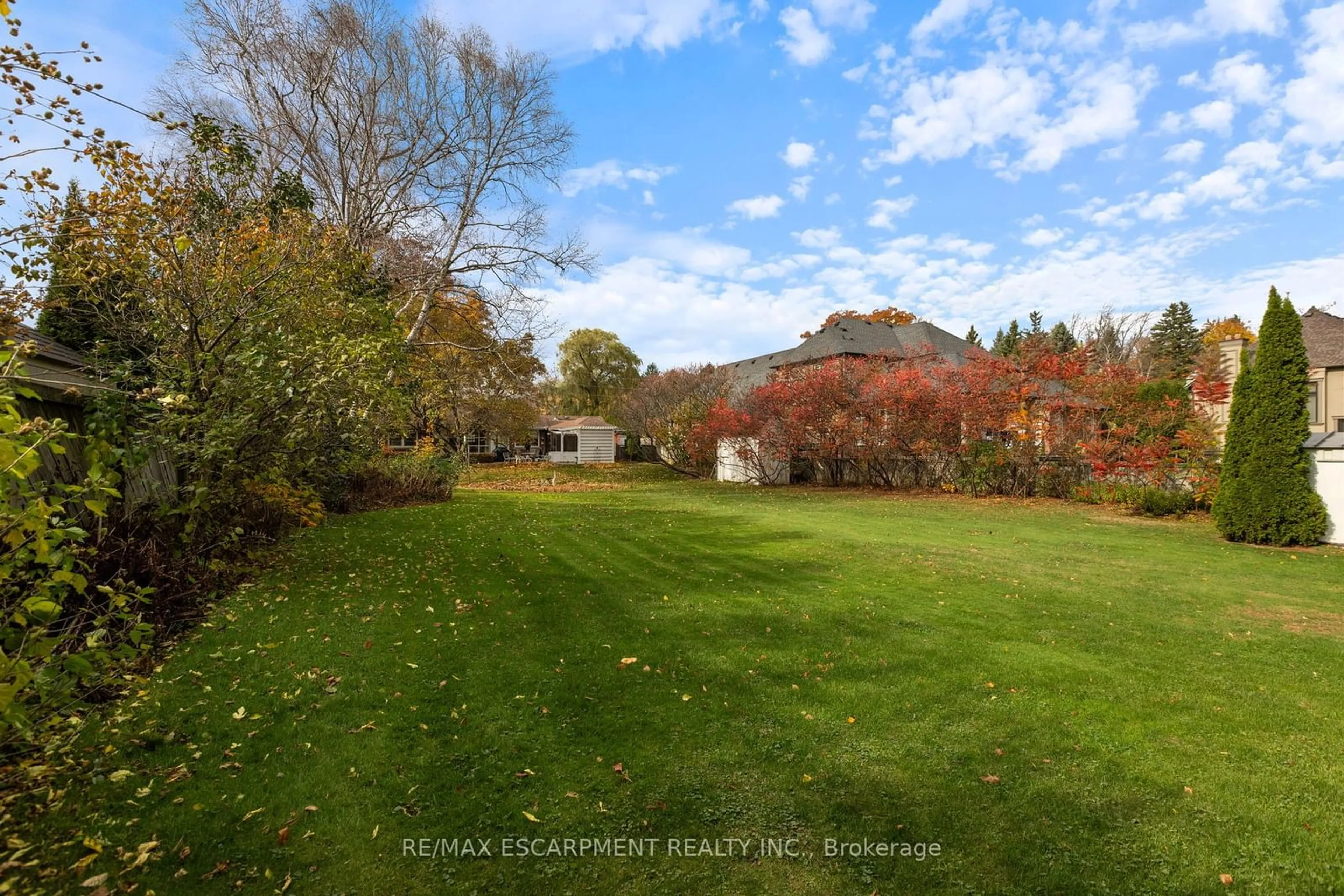 A pic from exterior of the house or condo, the fenced backyard for 53 Lovers Lane, Hamilton Ontario L9G 1G5