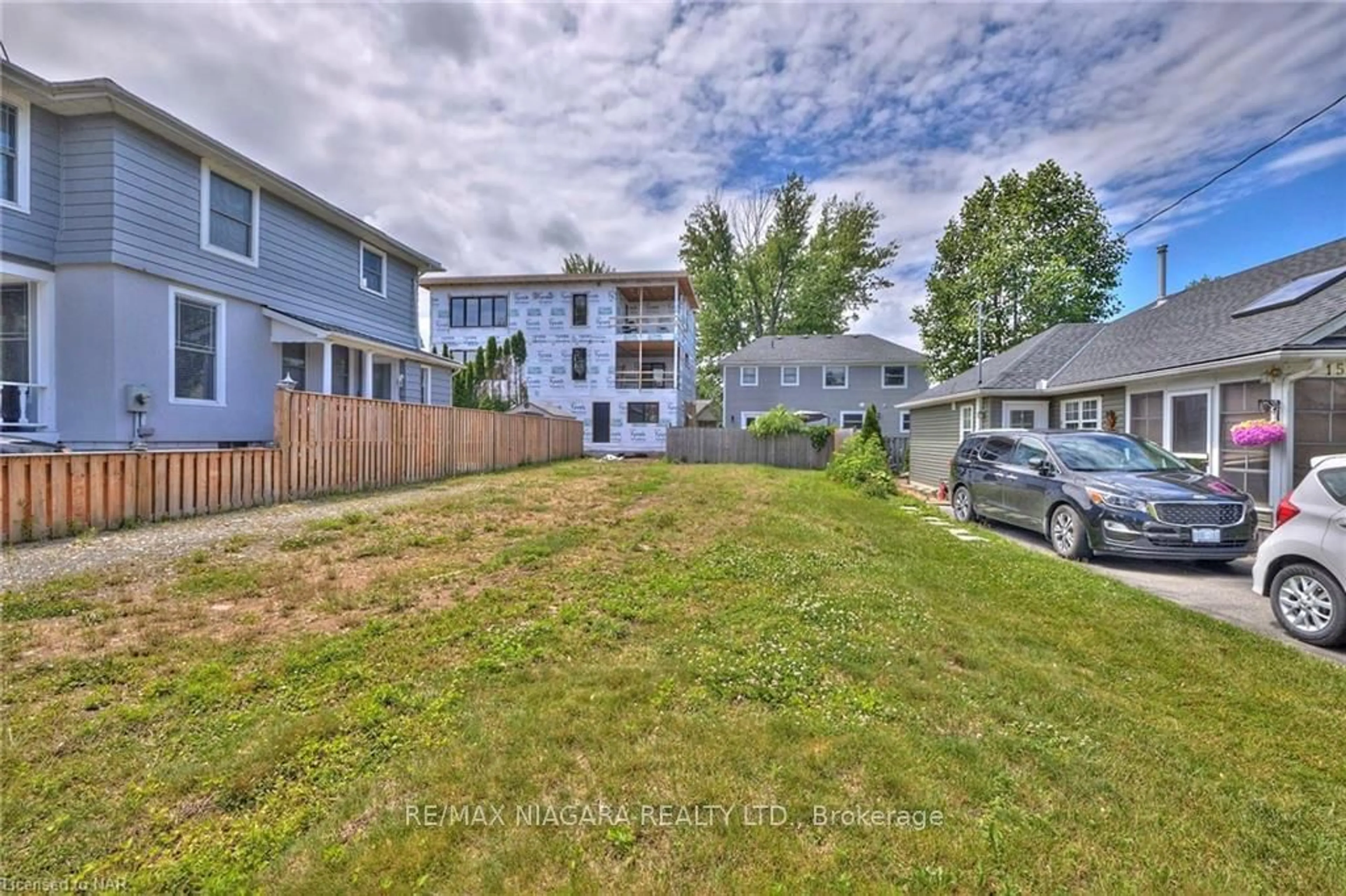 A pic from exterior of the house or condo, the fenced backyard for 13 Shelley Ave, St. Catharines Ontario L2N 5L4