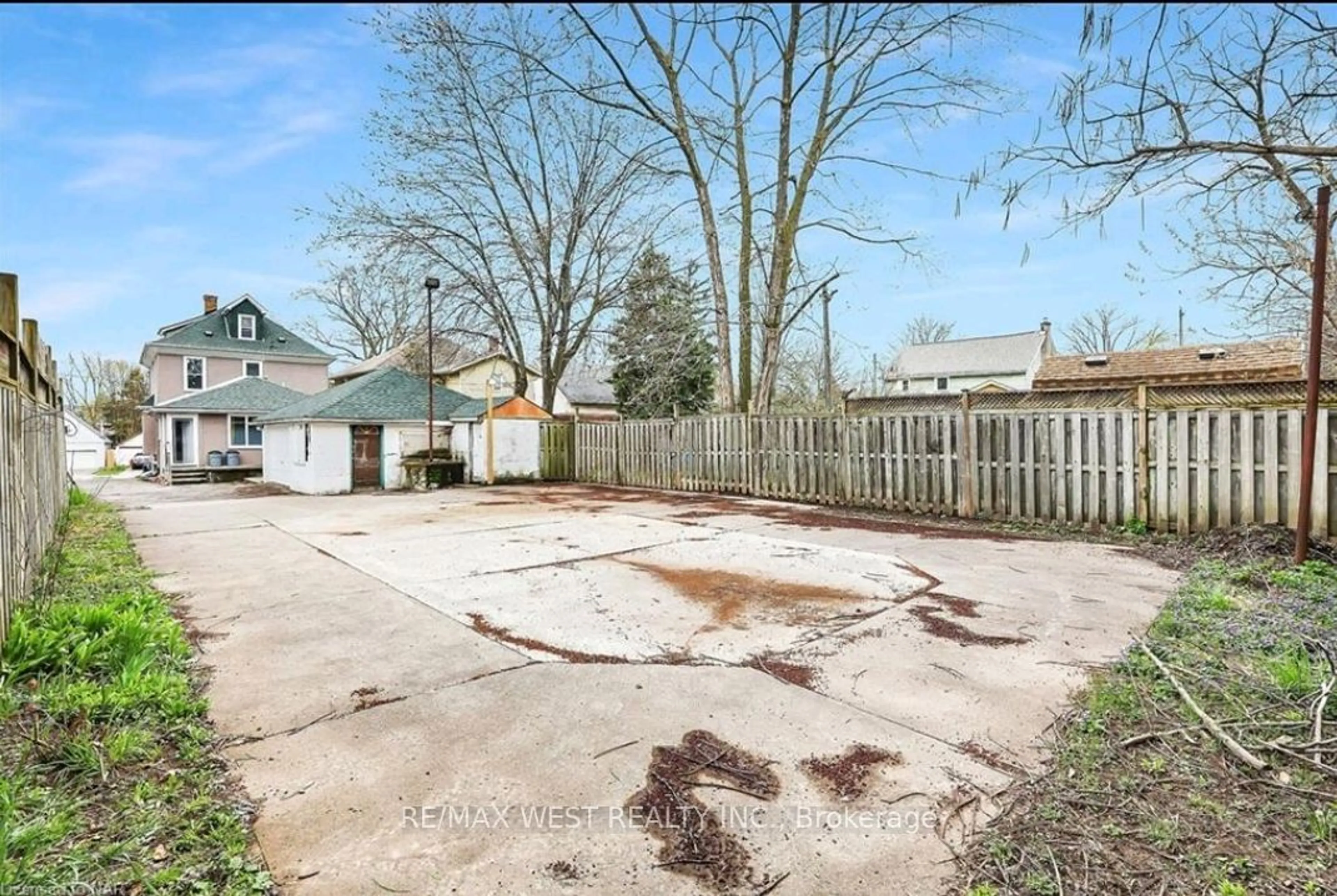 Frontside or backside of a home, the fenced backyard for 6175 barker St, Niagara Falls Ontario L2G 1Y5