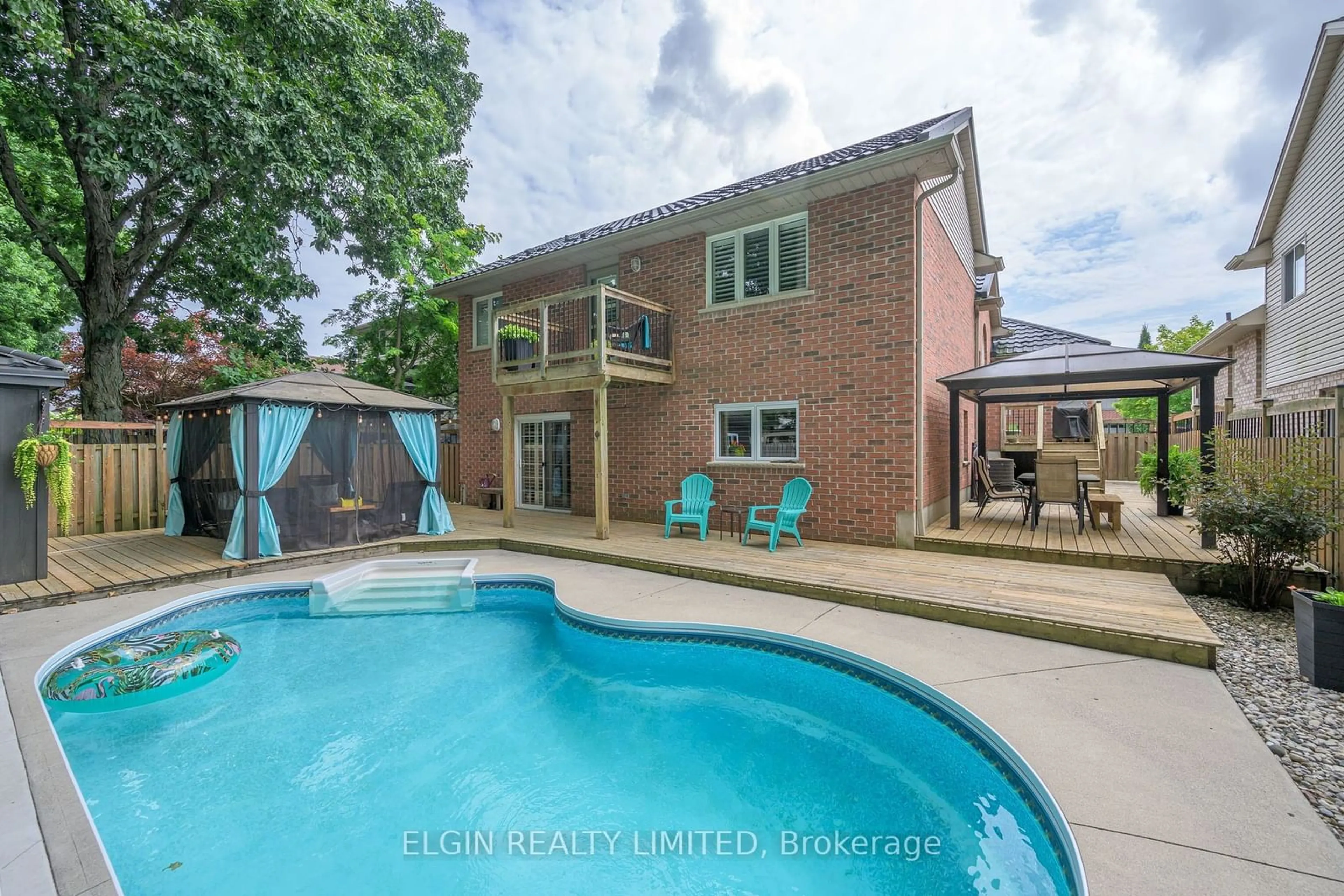 Frontside or backside of a home, the fenced backyard for 15 HUMMINGBIRD Lane, St. Thomas Ontario N5R 6L8