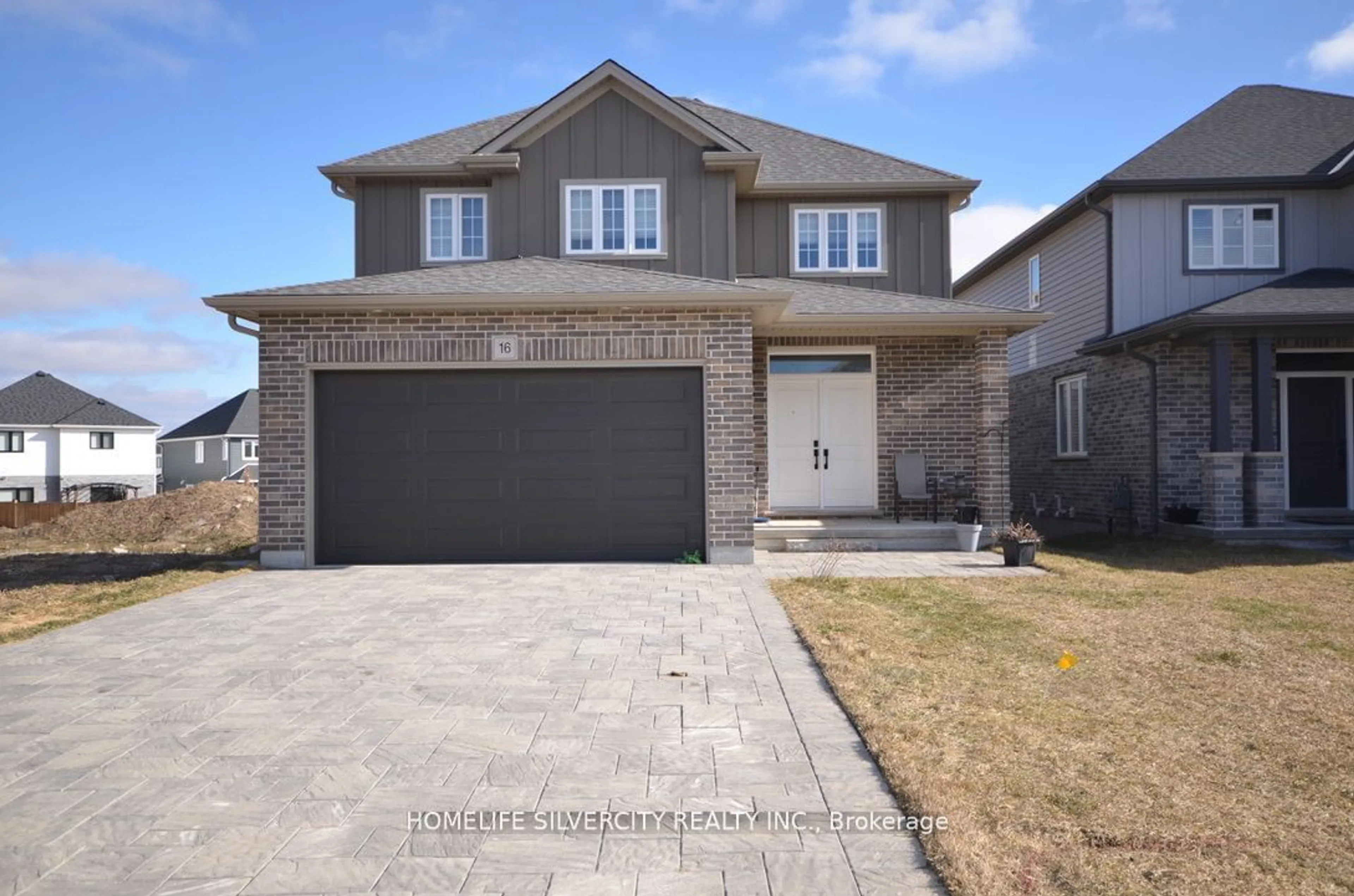 Frontside or backside of a home, the street view for 16 Basil Cres, Middlesex Centre Ontario N0M 2A0