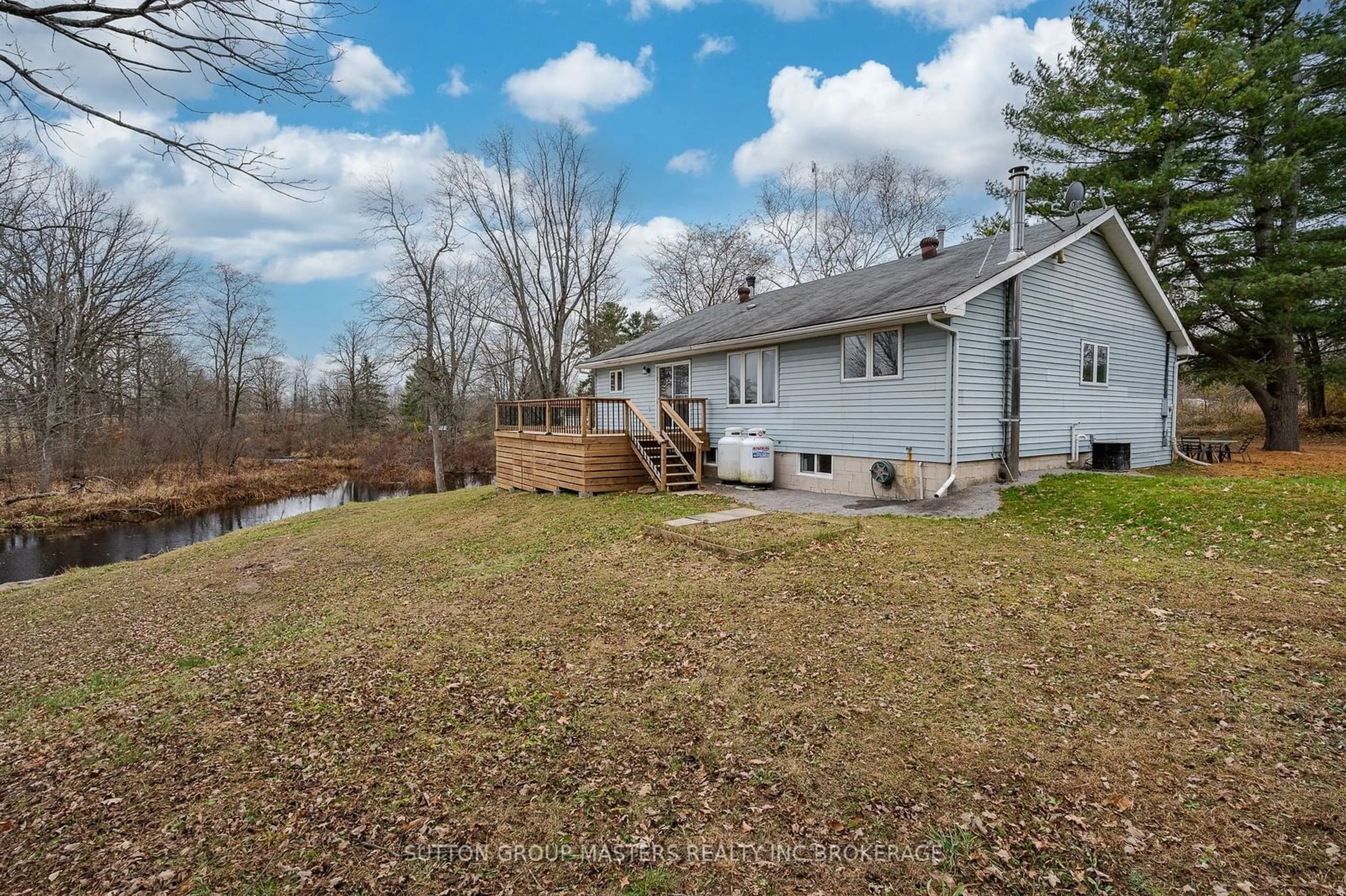 Frontside or backside of a home, the fenced backyard for 5972 FIRST LAKE Rd, South Frontenac Ontario K0H 2W0