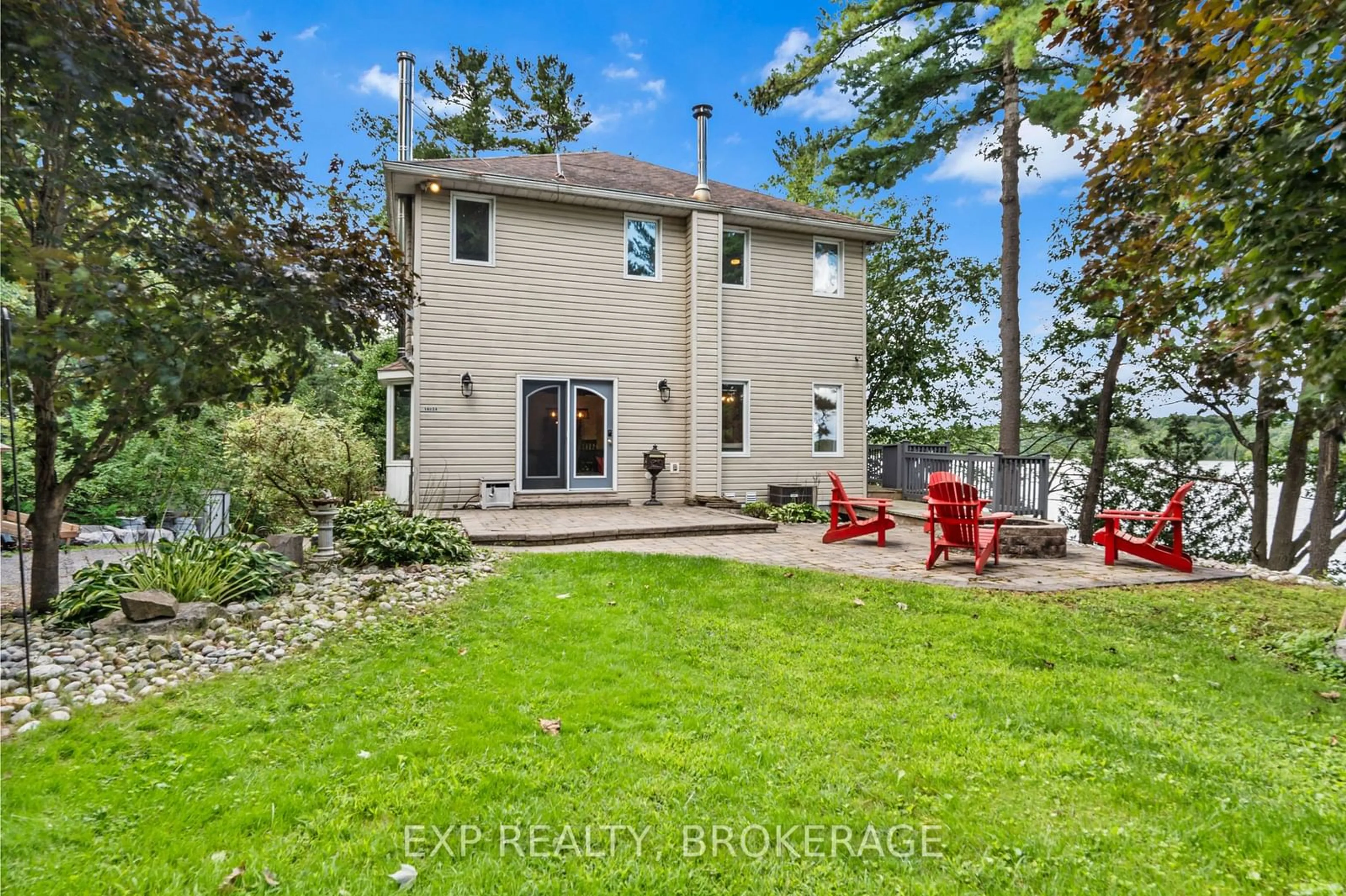 Frontside or backside of a home, the fenced backyard for 1403A EVERETT Lane, South Frontenac Ontario K0H 2T0