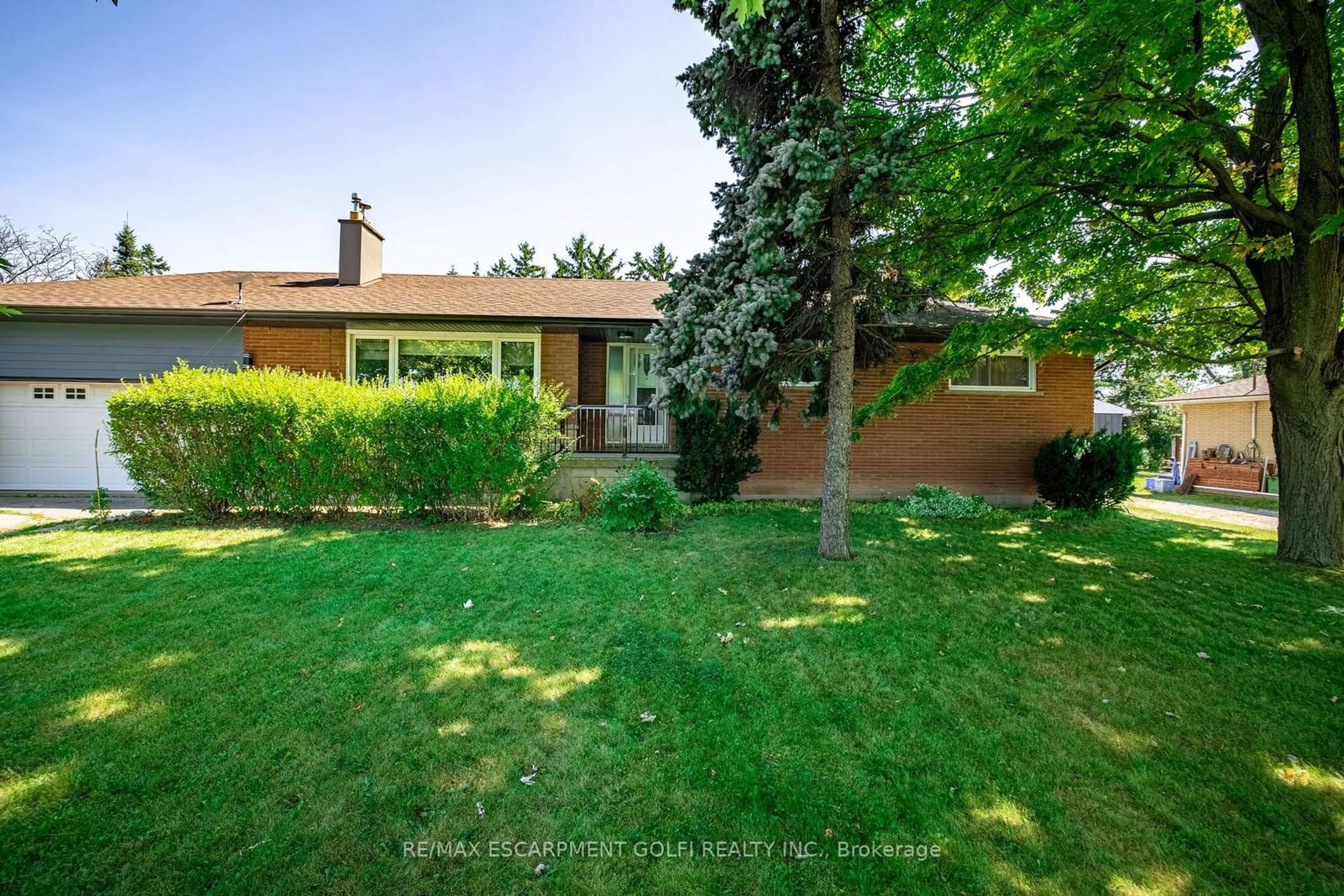 Frontside or backside of a home, the fenced backyard for 4315 Highway #6, Hamilton Ontario L0R 1W0