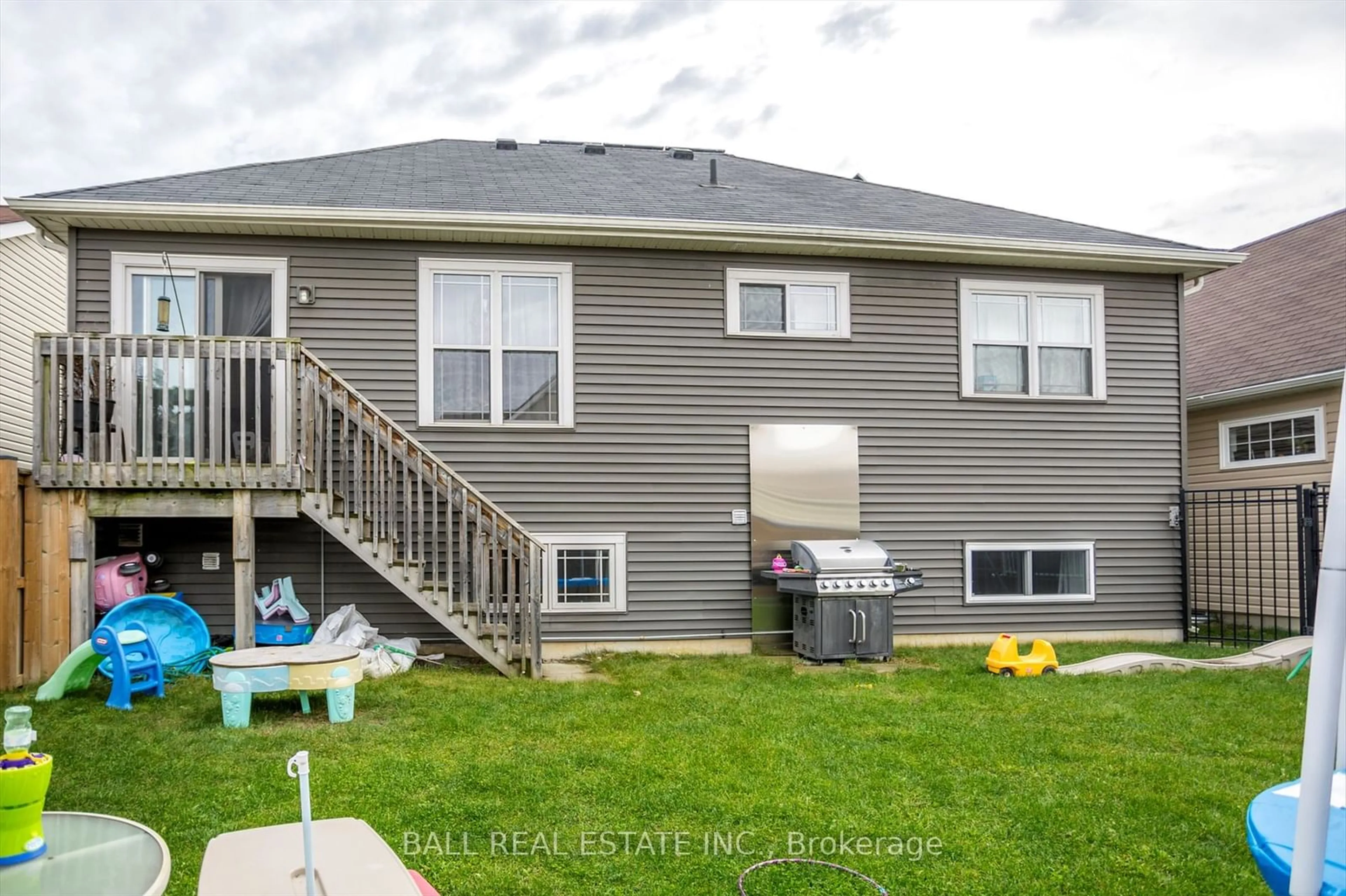 Frontside or backside of a home, the fenced backyard for 584 Grange Way, Peterborough Ontario K9H 0G5