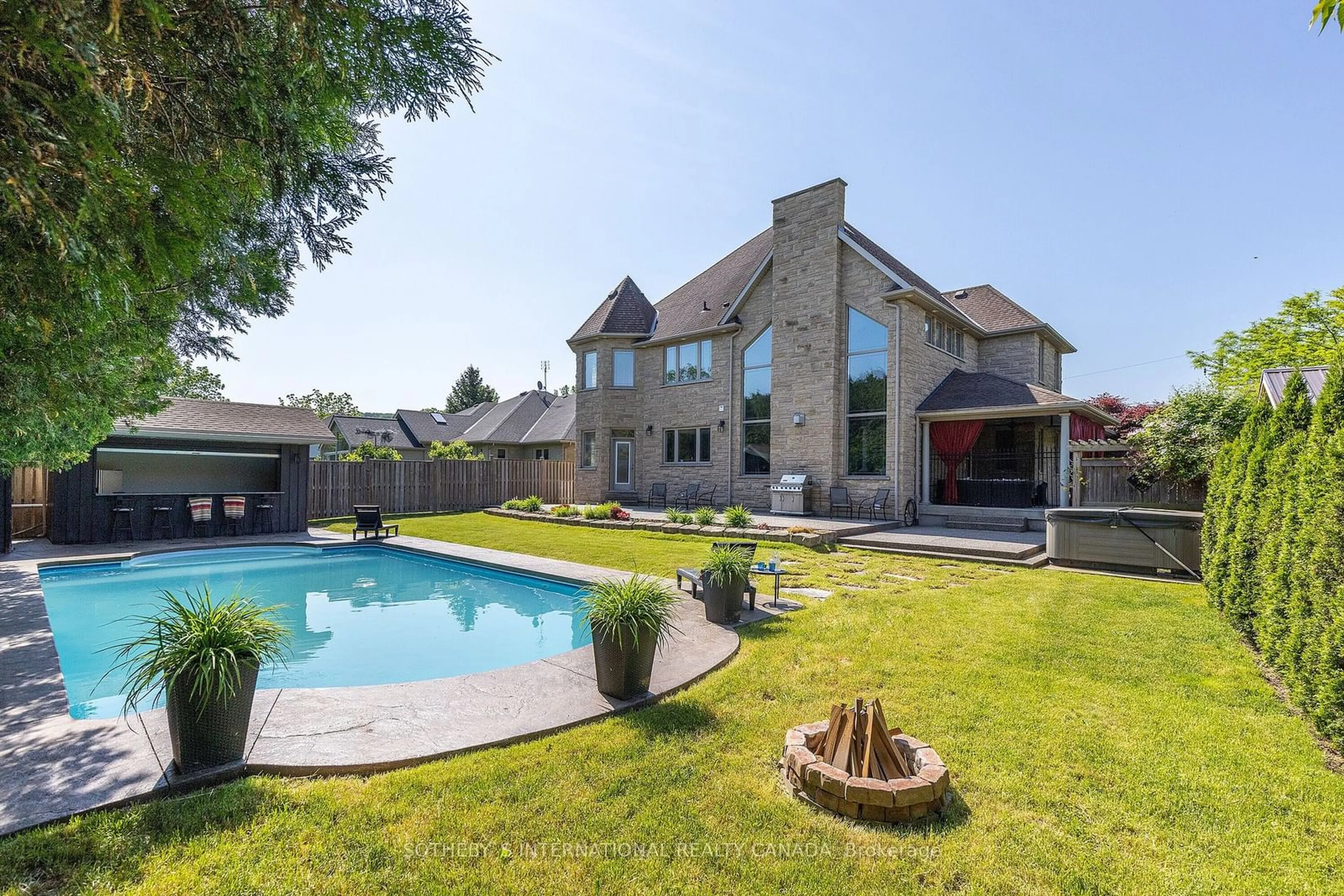 Frontside or backside of a home, the fenced backyard for 790 Warner Rd, Niagara-on-the-Lake Ontario L0S 1J0