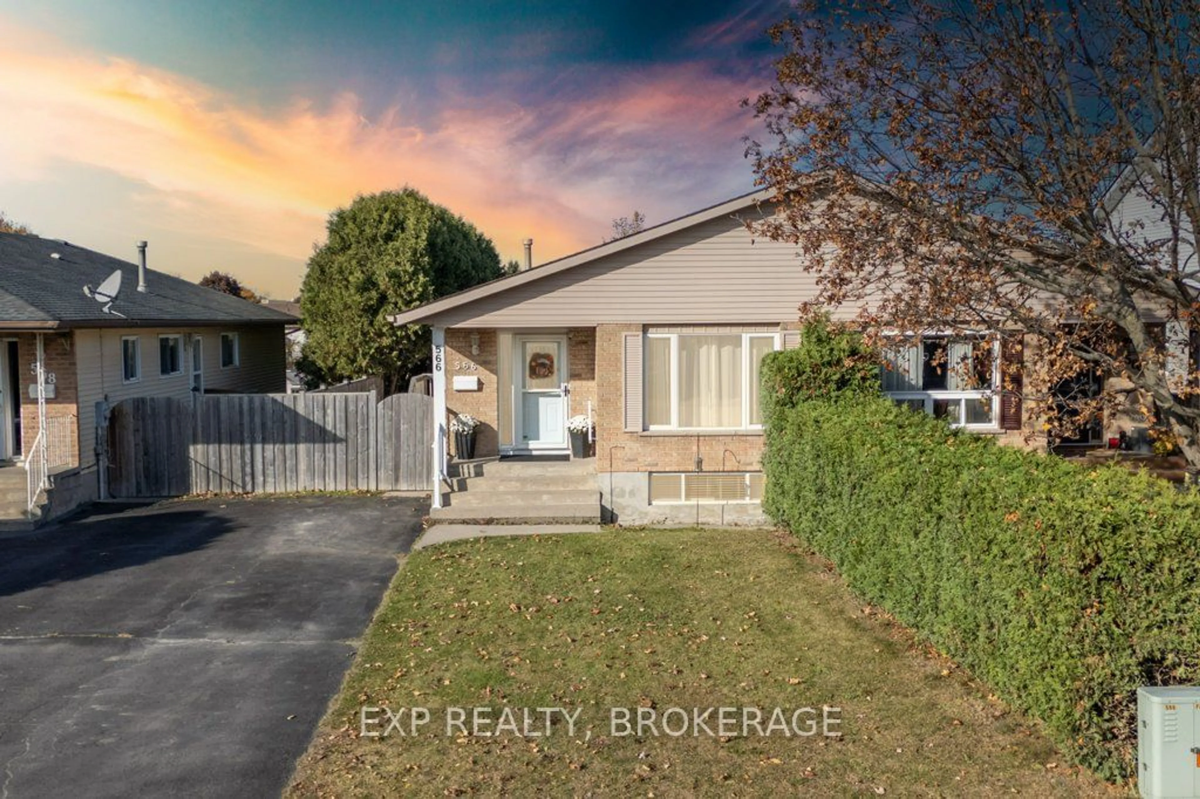 Frontside or backside of a home, the fenced backyard for 566 Whistler Terr, Kingston Ontario K7M 8K4