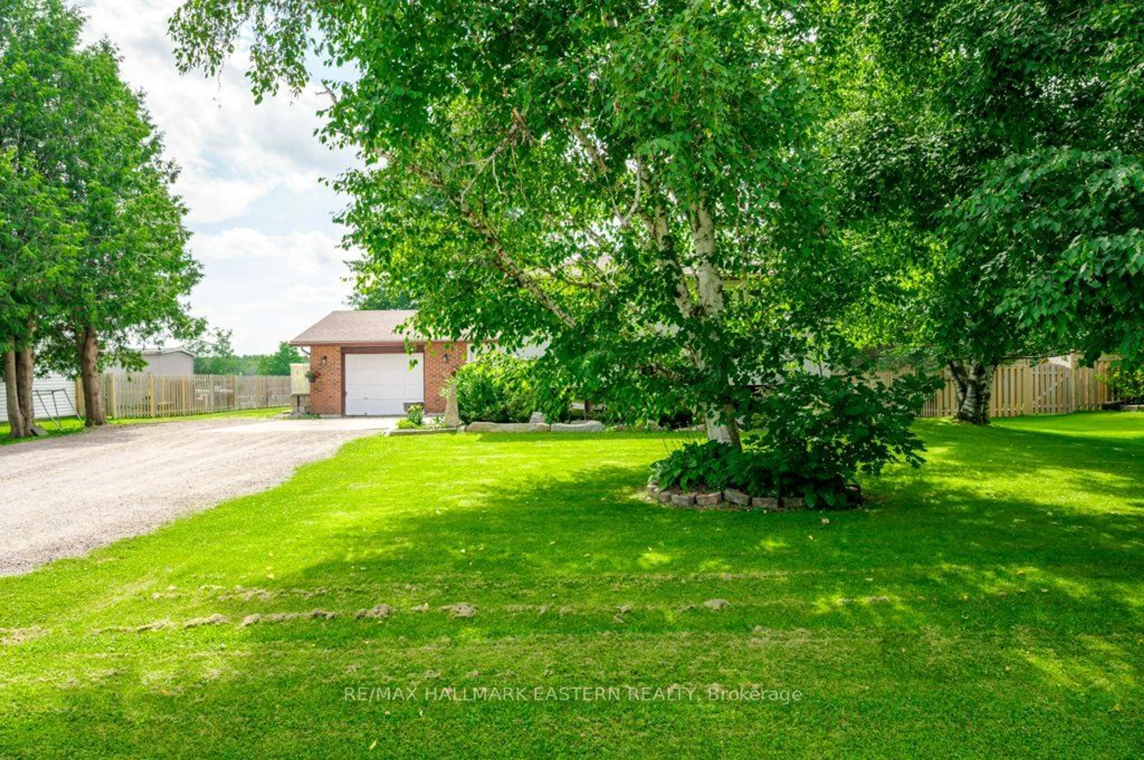 Frontside or backside of a home, the fenced backyard for 660 Pope Dr, Smith-Ennismore-Lakefield Ontario K0L 1T0