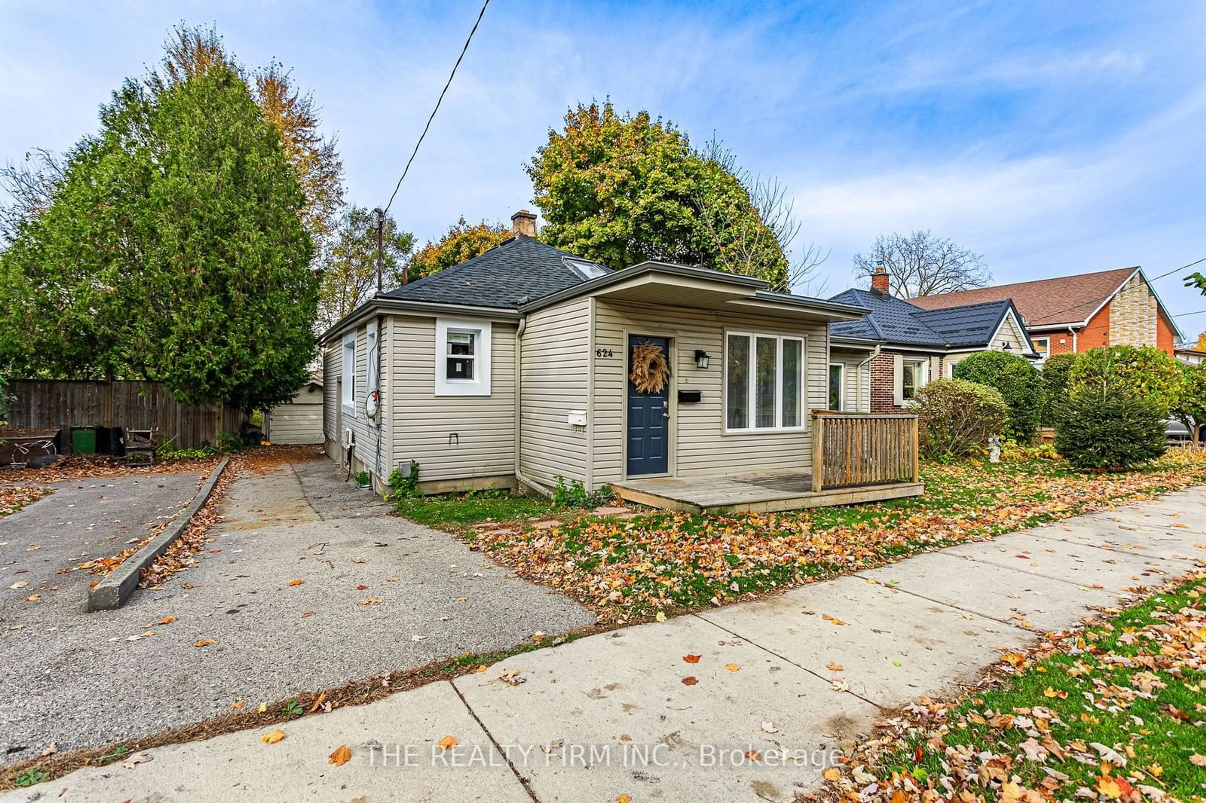 Frontside or backside of a home, the fenced backyard for 624 Grosvenor St, London Ontario N5Y 3T4