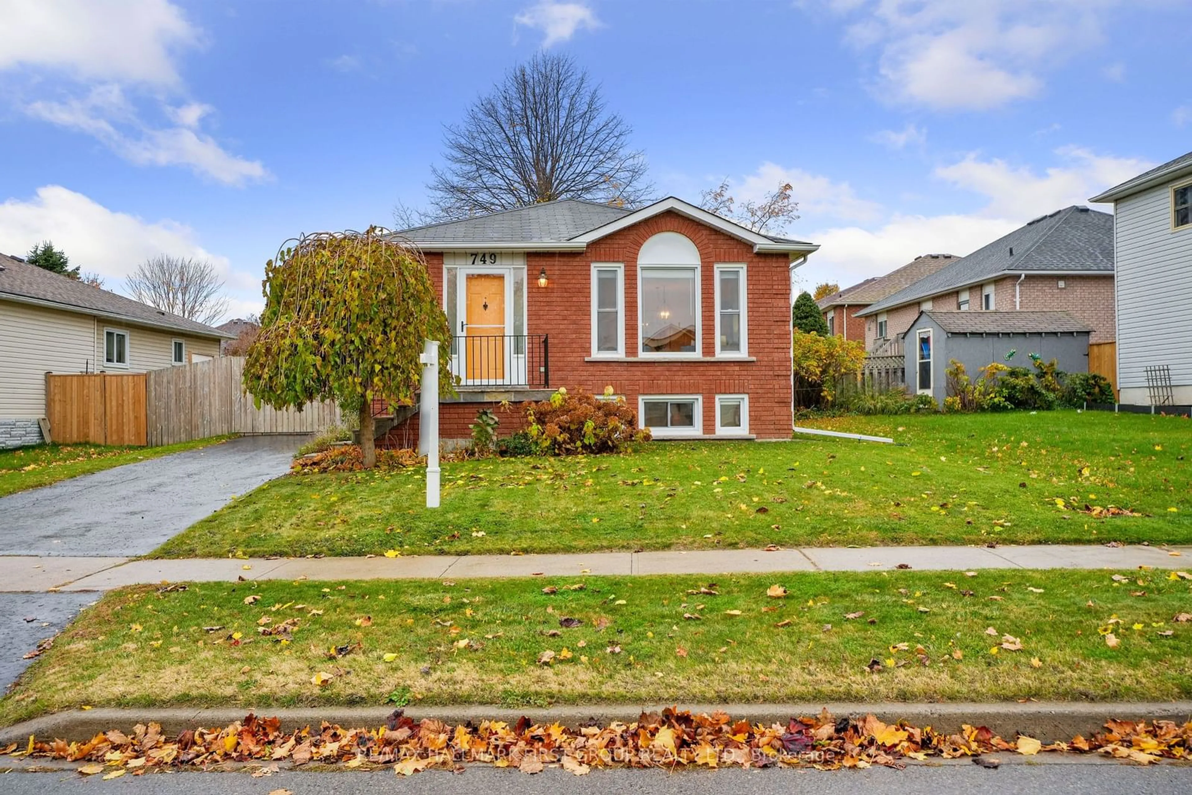 Frontside or backside of a home, the fenced backyard for 749 Ewing St, Cobourg Ontario K9A 5P1