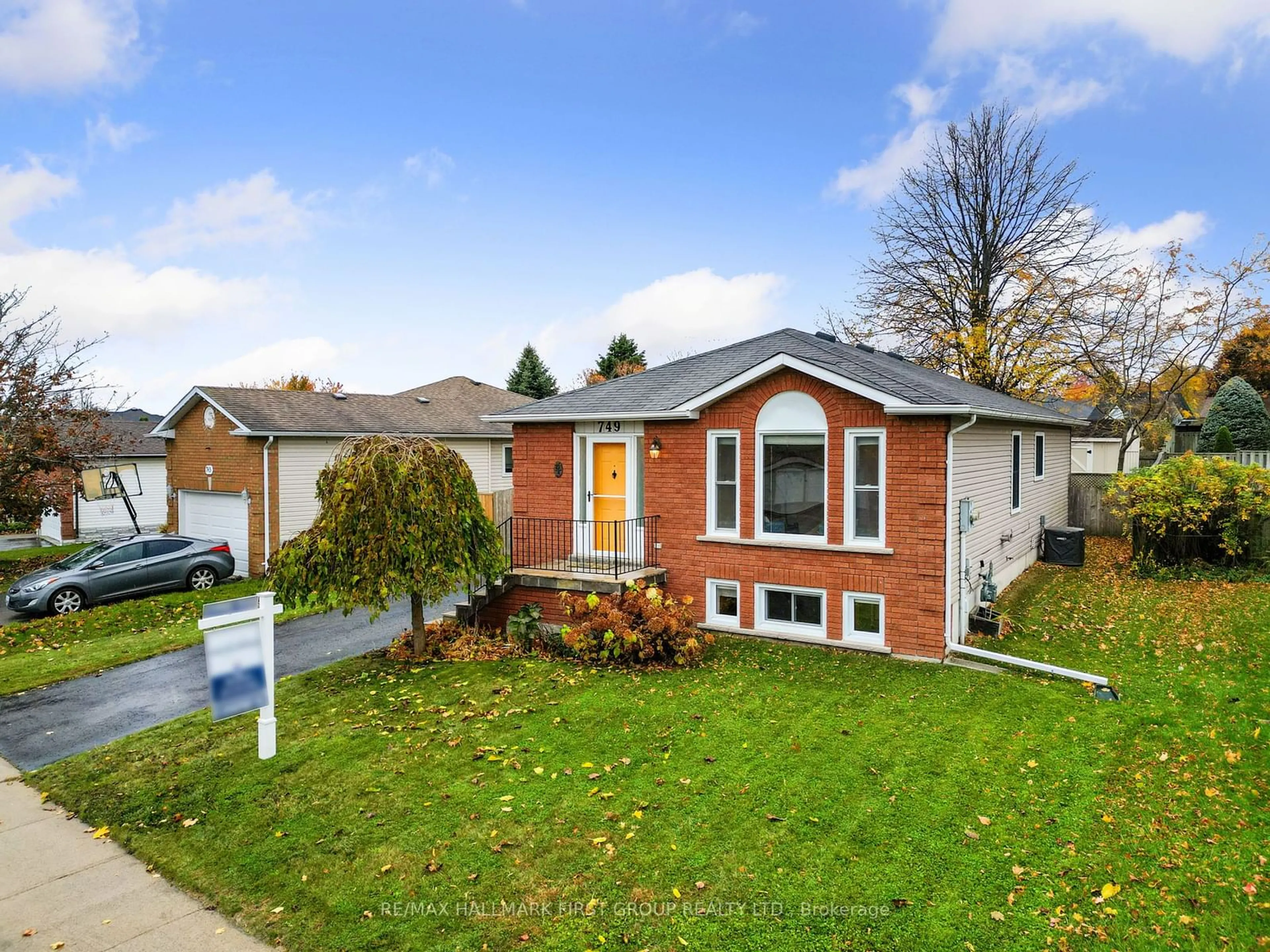 Frontside or backside of a home, the fenced backyard for 749 Ewing St, Cobourg Ontario K9A 5P1