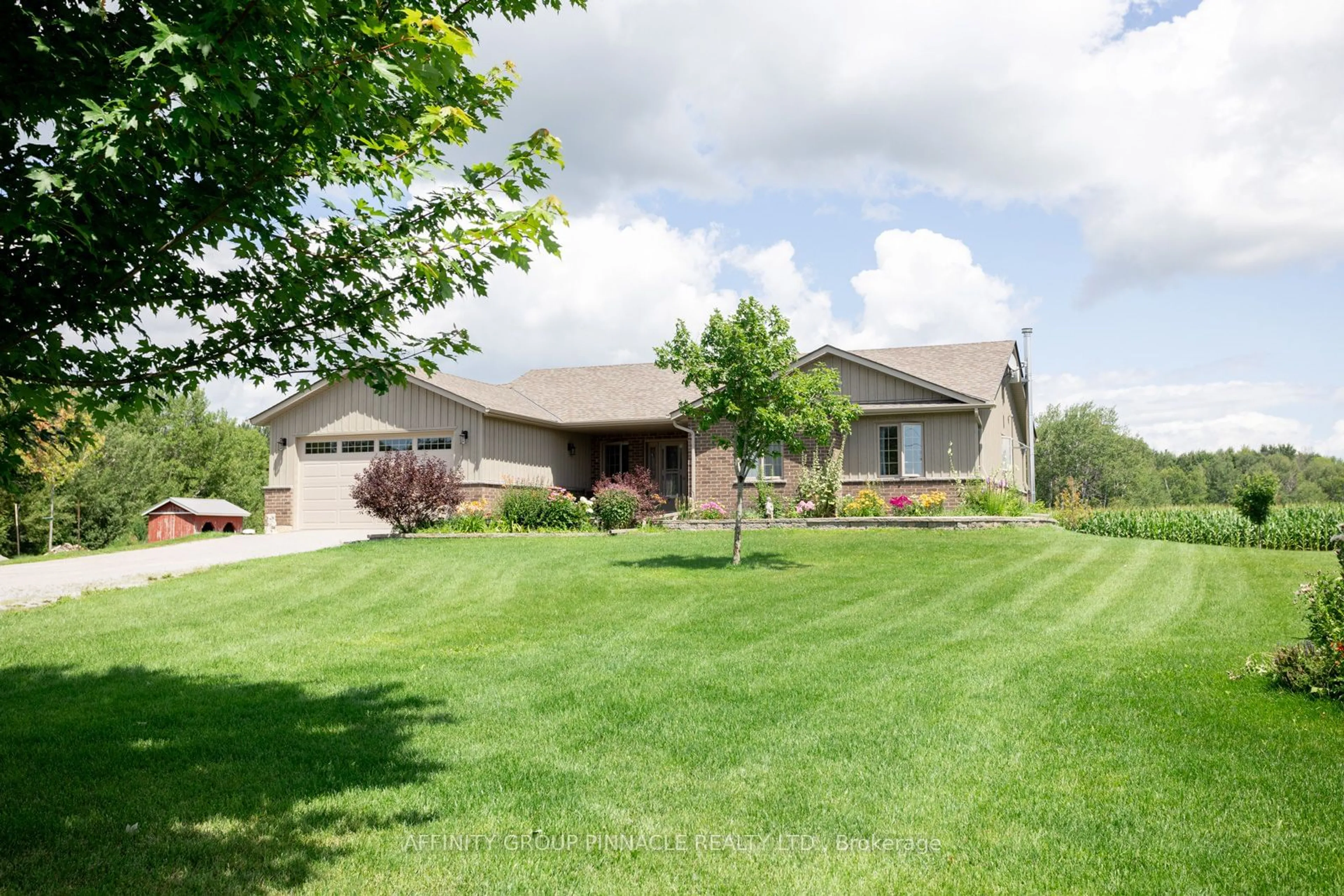 Frontside or backside of a home, the fenced backyard for 654 White Rock Rd, Kawartha Lakes Ontario K0M 2M0