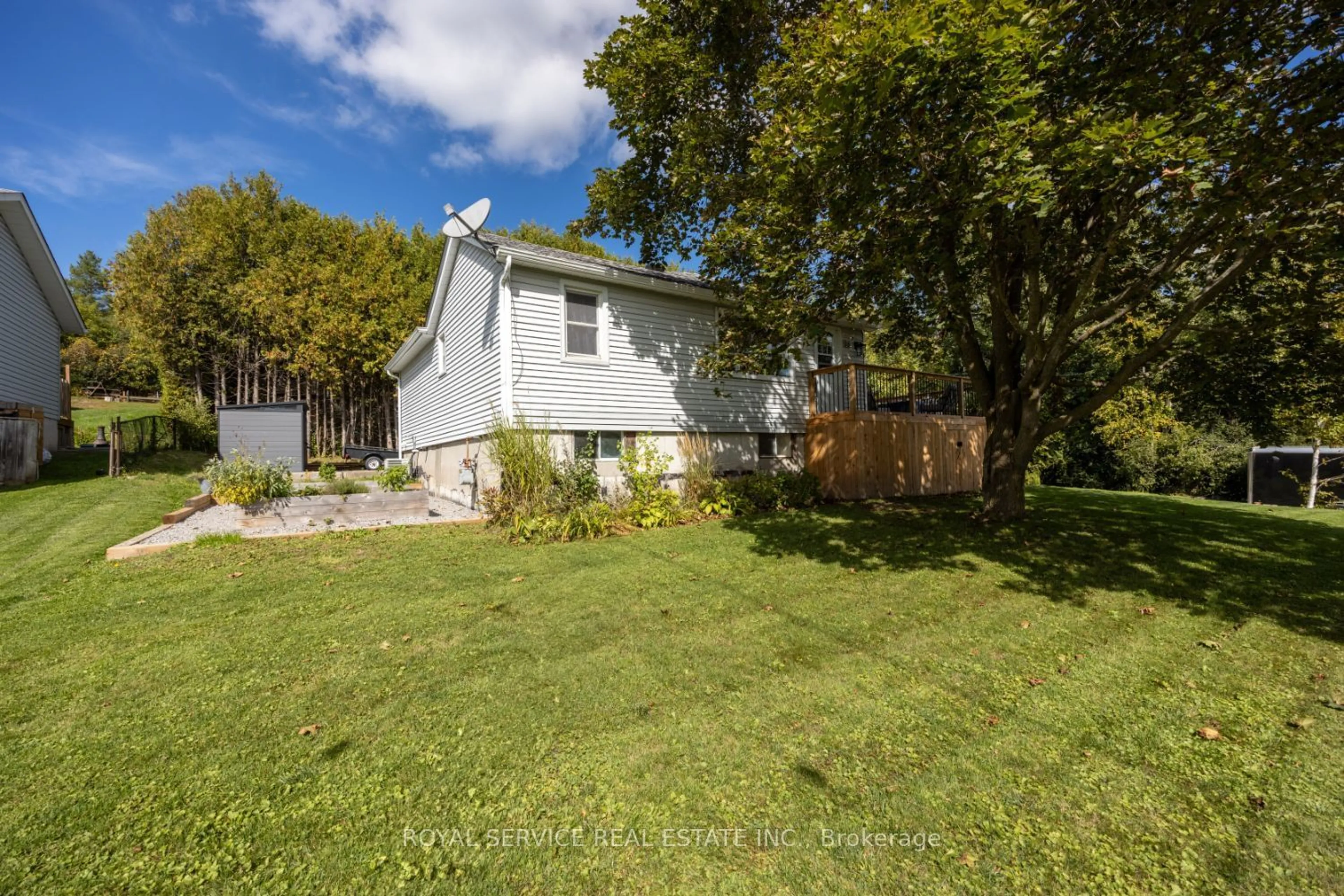 Frontside or backside of a home, the fenced backyard for 16 Hunter St, Cavan Monaghan Ontario L0A 1G0