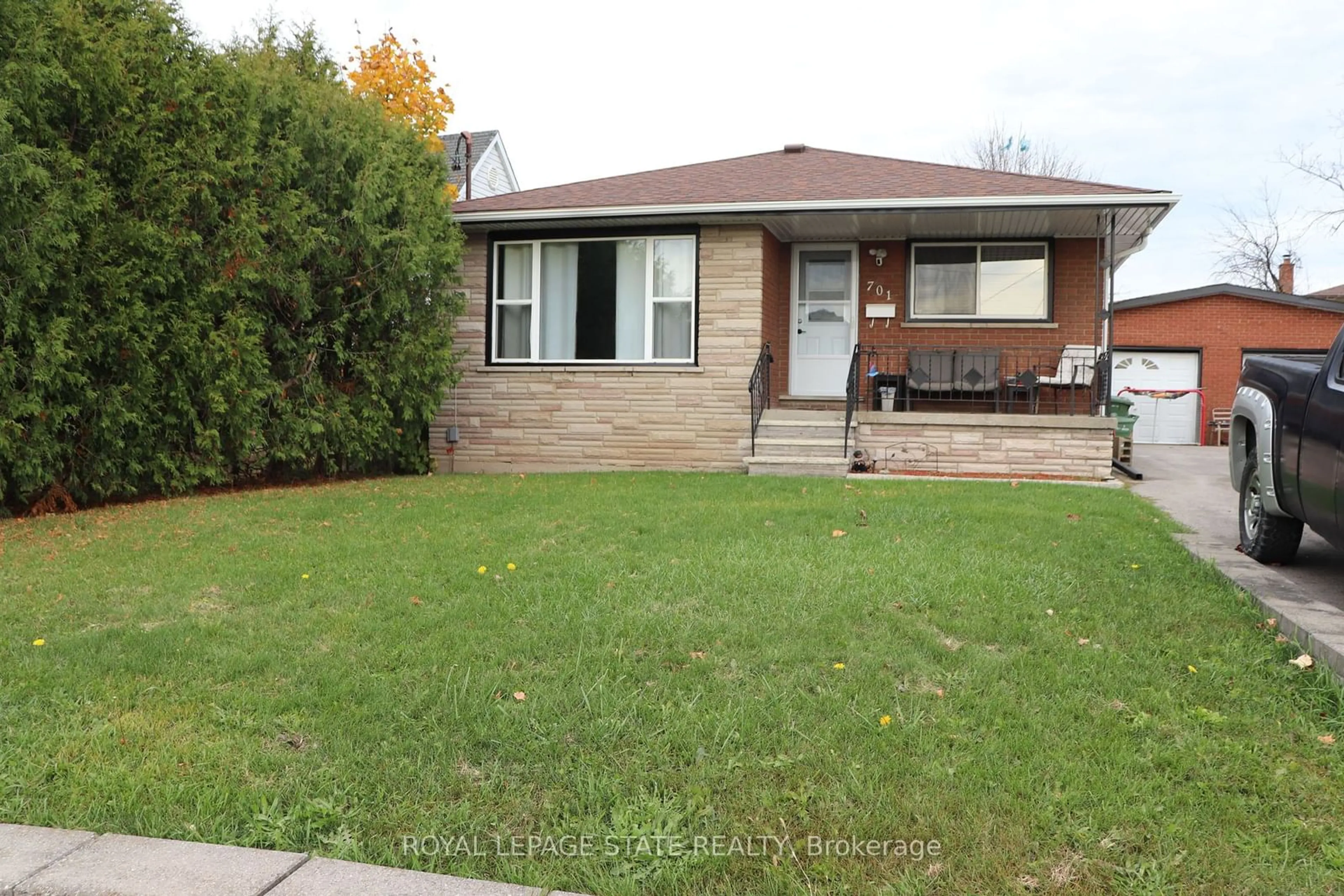 Frontside or backside of a home, the fenced backyard for 701 Limeridge Rd, Hamilton Ontario L8W 1A4