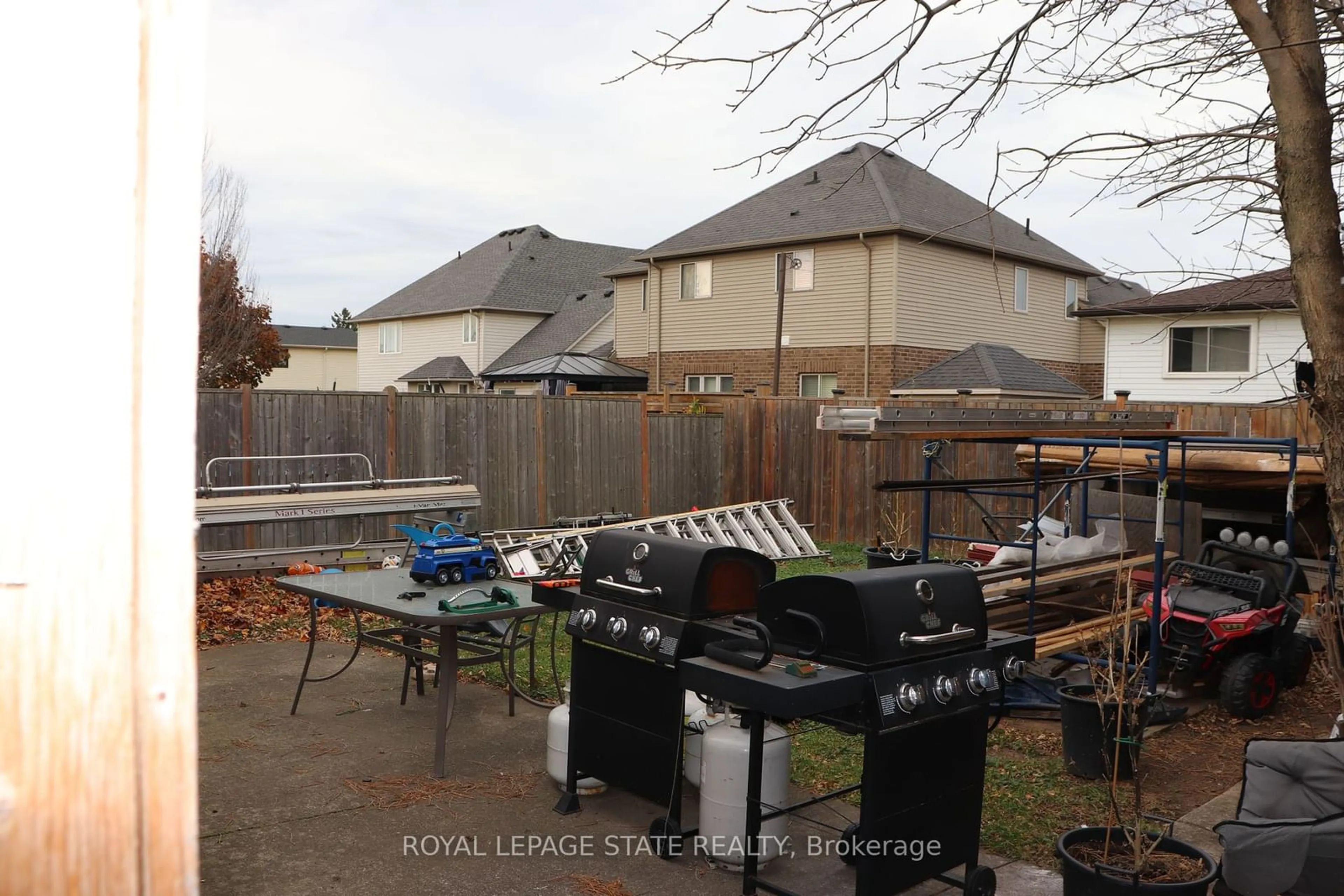 Frontside or backside of a home, the fenced backyard for 701 Limeridge Rd, Hamilton Ontario L8W 1A4