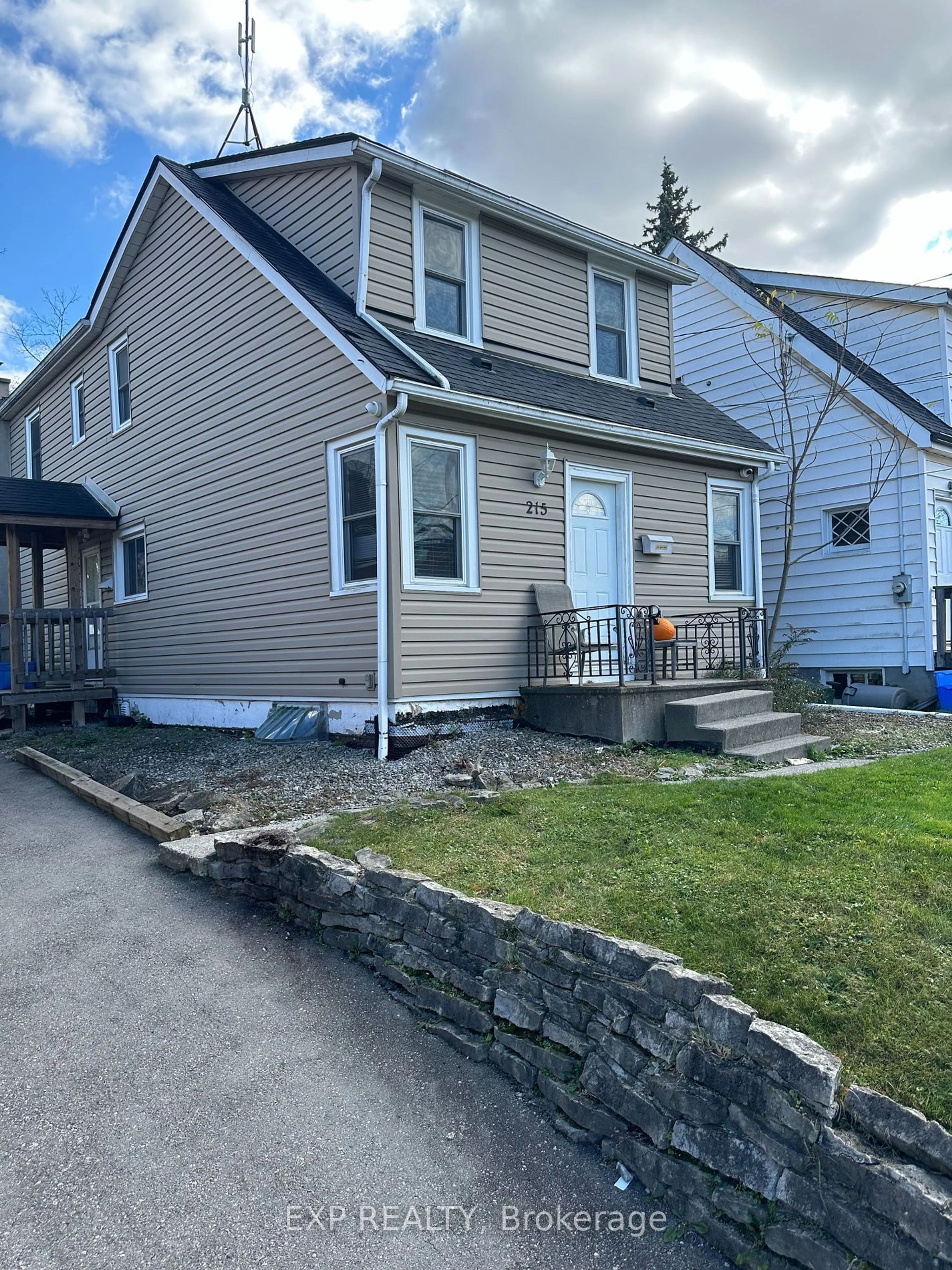 Frontside or backside of a home, the fenced backyard for 215 Emerson St, Hamilton Ontario L8S 2Y3