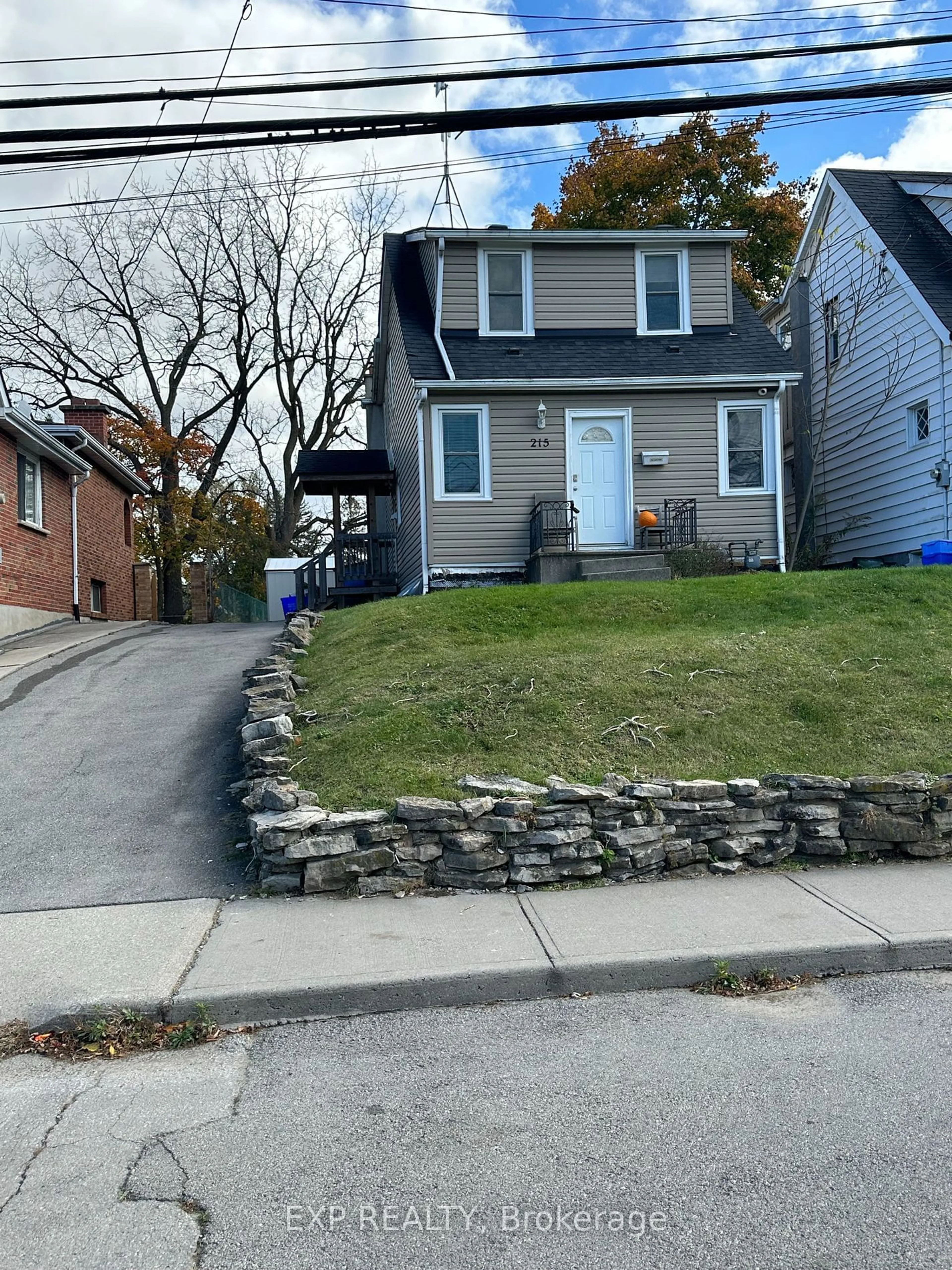 Frontside or backside of a home, the street view for 215 Emerson St, Hamilton Ontario L8S 2Y3