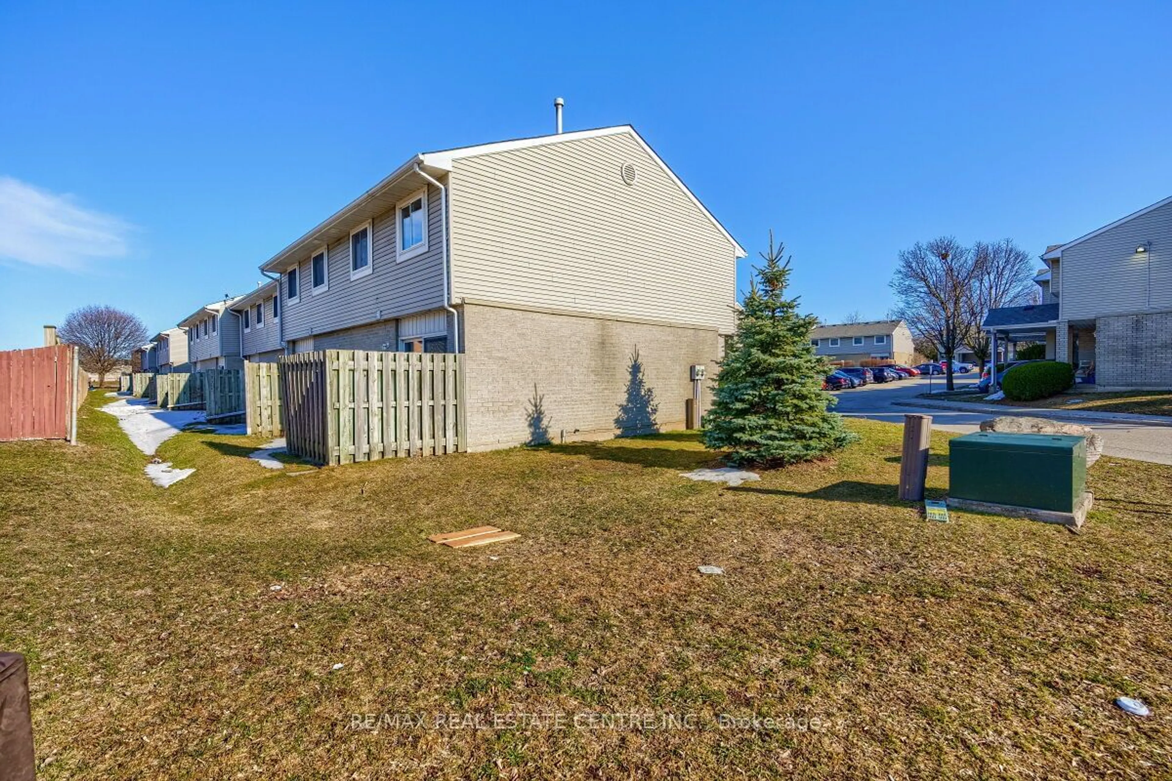 A pic from exterior of the house or condo, the fenced backyard for 125 Sekura Cres #1, Cambridge Ontario N1R 8B4