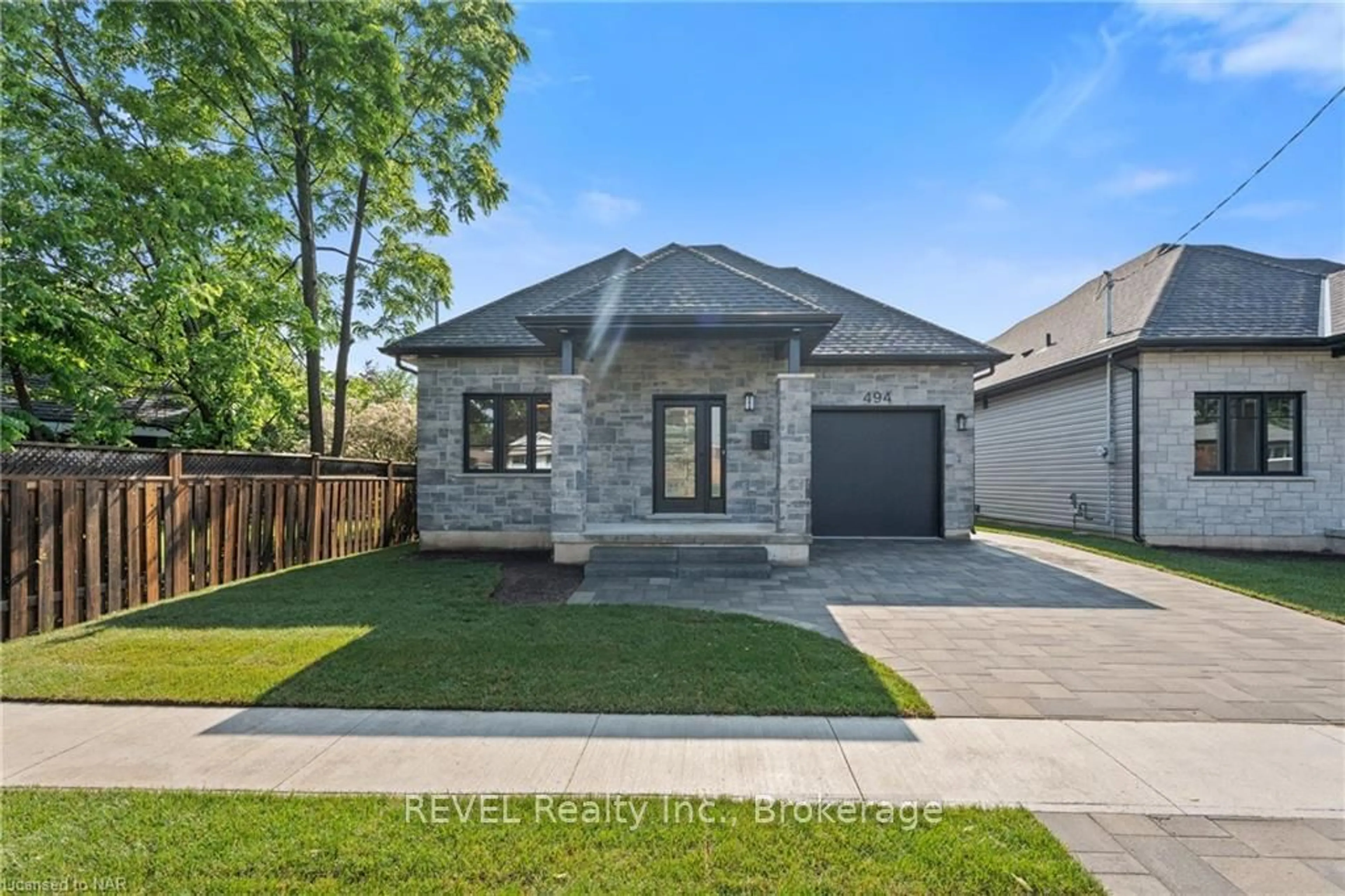 Frontside or backside of a home, the fenced backyard for 494 VINE St, St. Catharines Ontario L2M 3T6