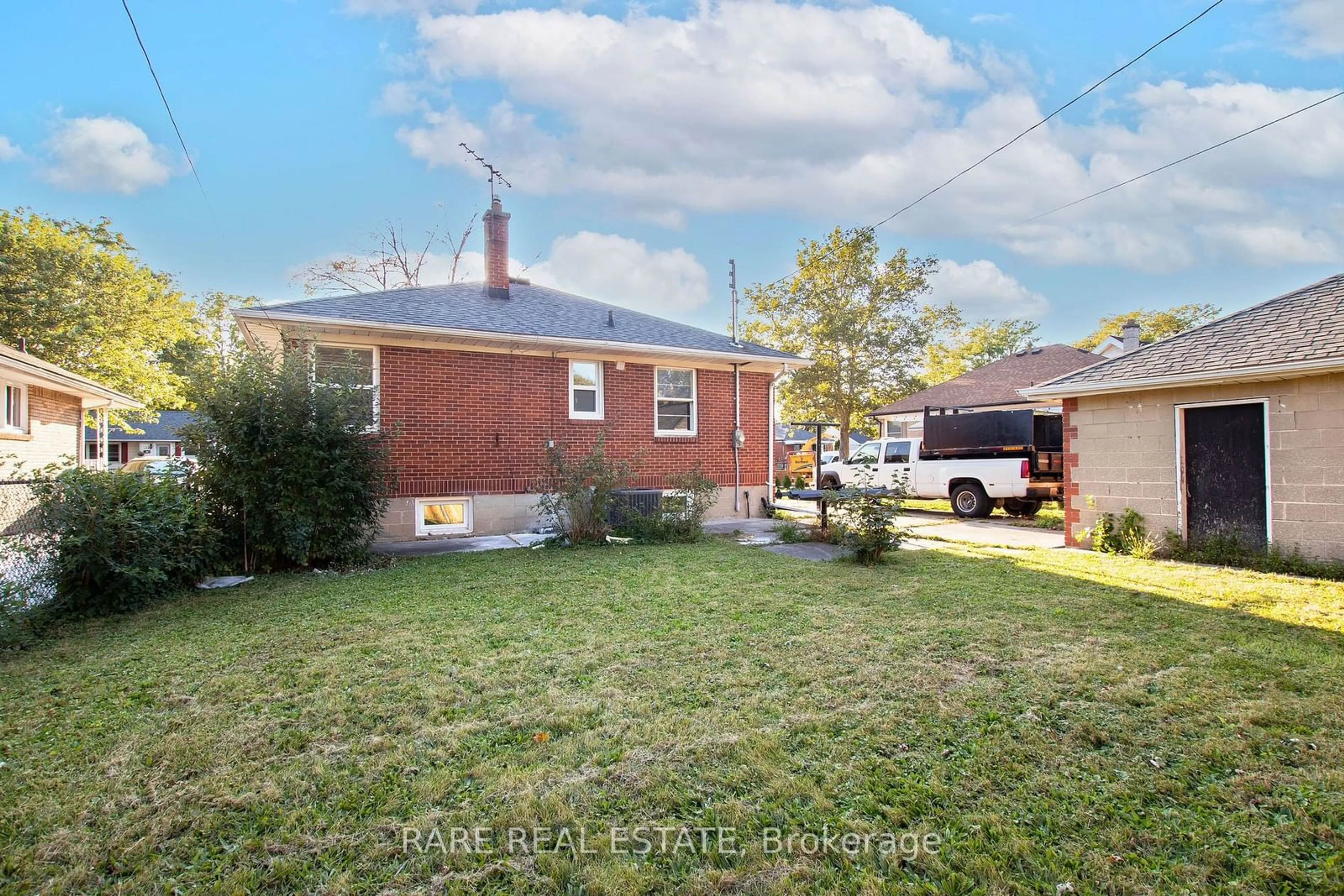 Frontside or backside of a home, the fenced backyard for 1544 Pillette Rd, Windsor Ontario N8Y 3C2