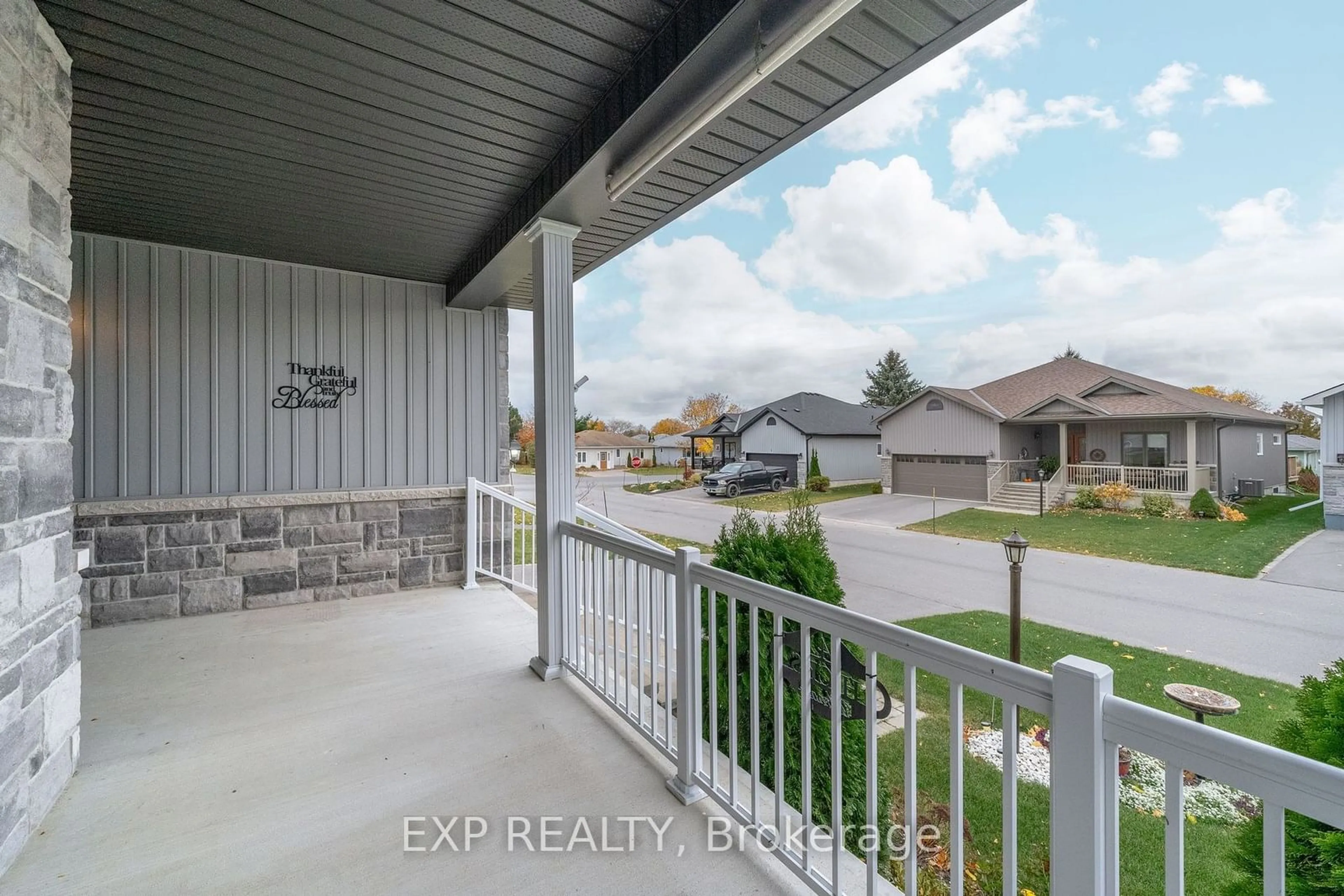 Frontside or backside of a home, the fenced backyard for 4 Dorchester Dr, Prince Edward County Ontario K0K 3L0