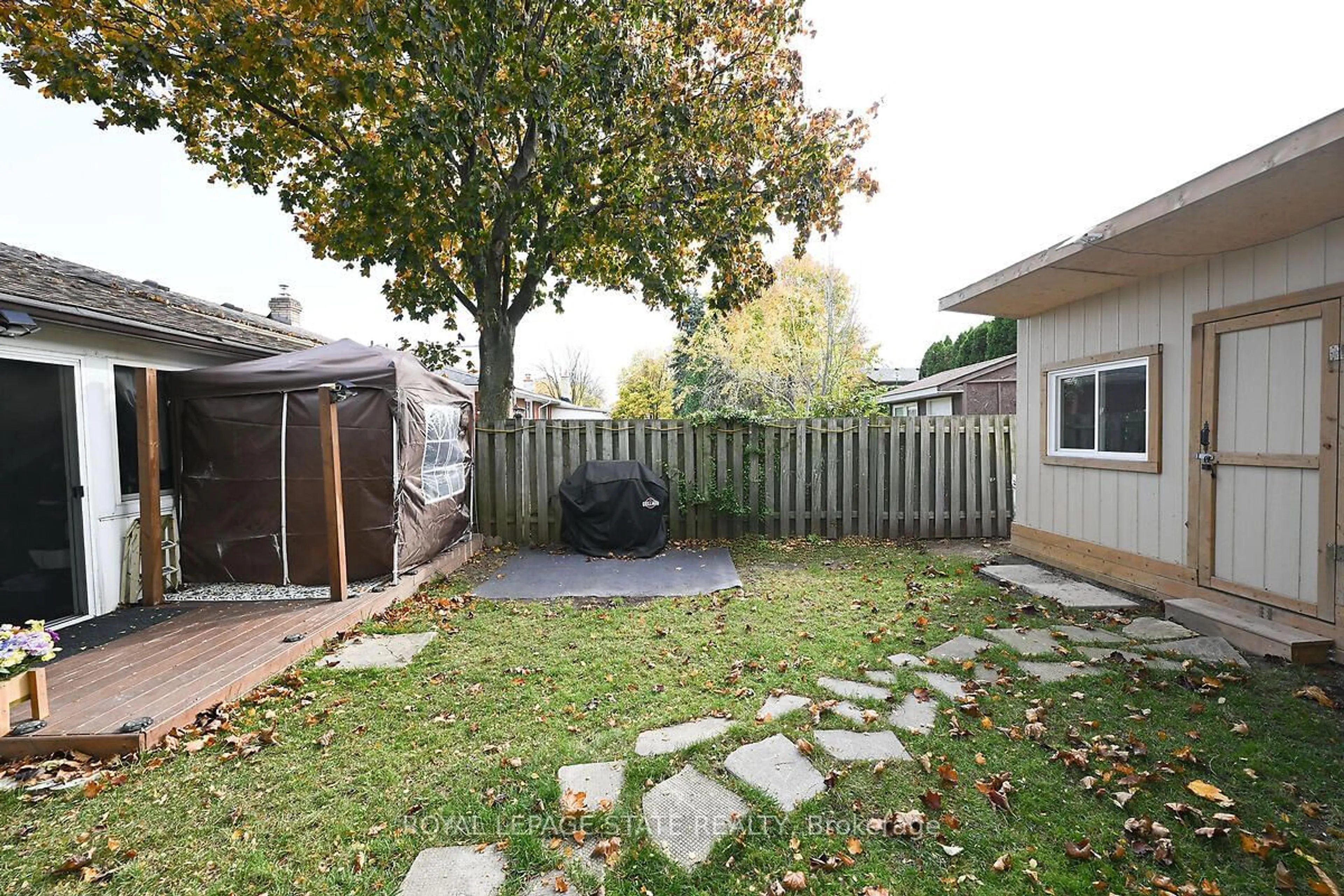 Patio, the fenced backyard for 511 Stone Church Rd, Hamilton Ontario L9B 1A5