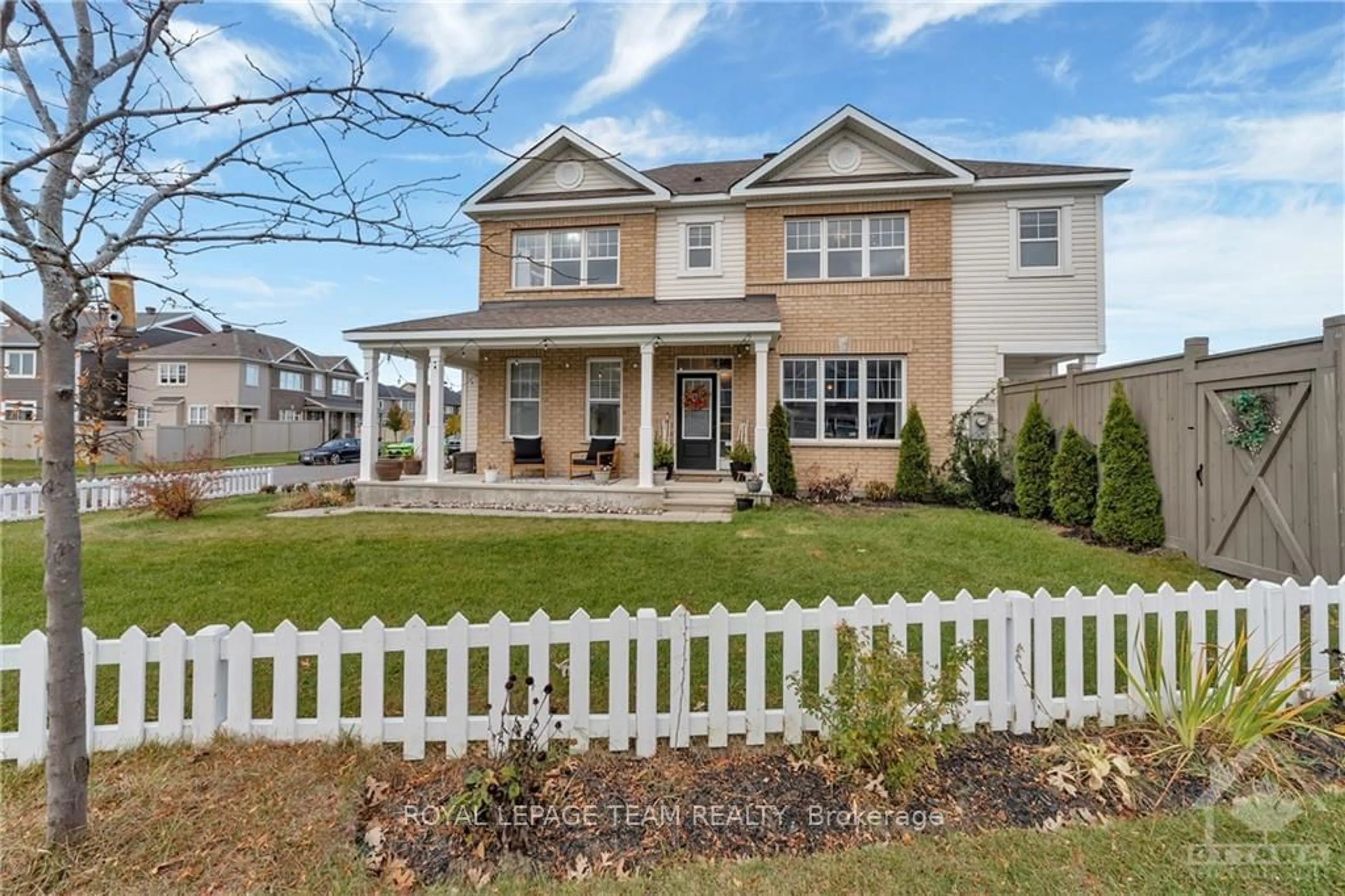 Frontside or backside of a home, the fenced backyard for 100 BURBOT St, Barrhaven Ontario K2J 6J7