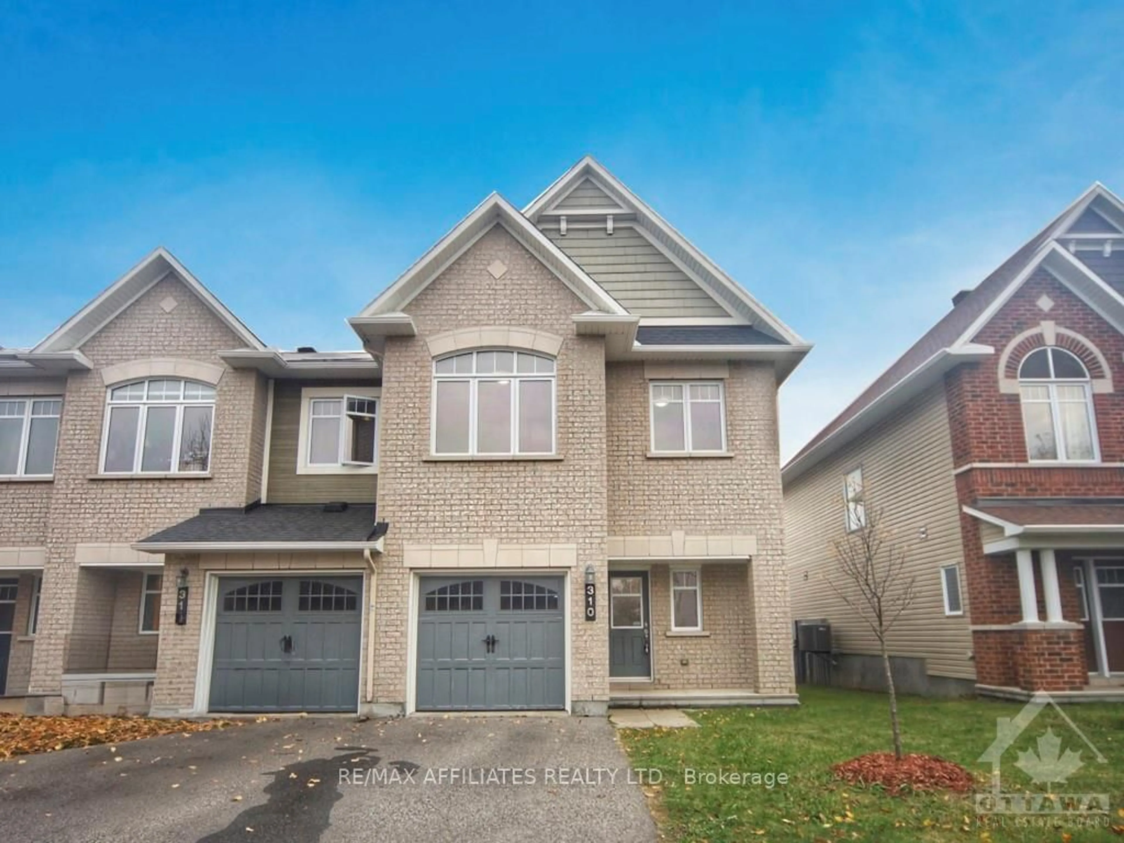 Frontside or backside of a home, the street view for 310 TOURMALINE Cres, Barrhaven Ontario K2J 5X3