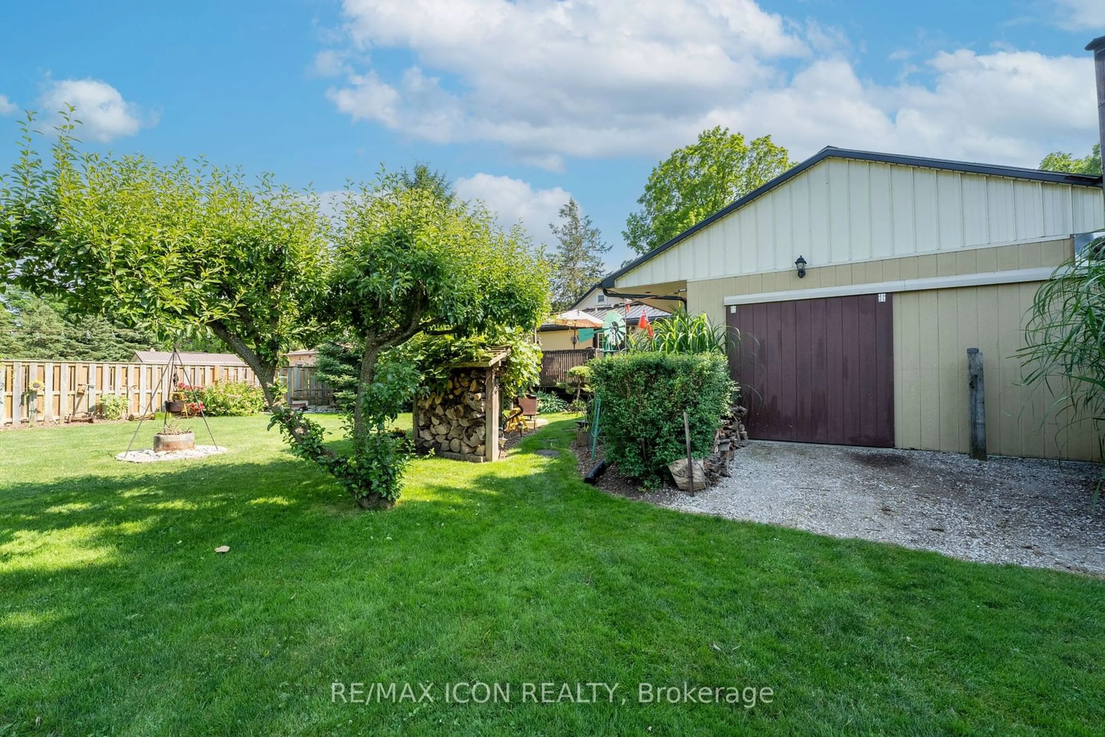 Frontside or backside of a home, the fenced backyard for 258 Anna St, North Middlesex Ontario N0M 2K0