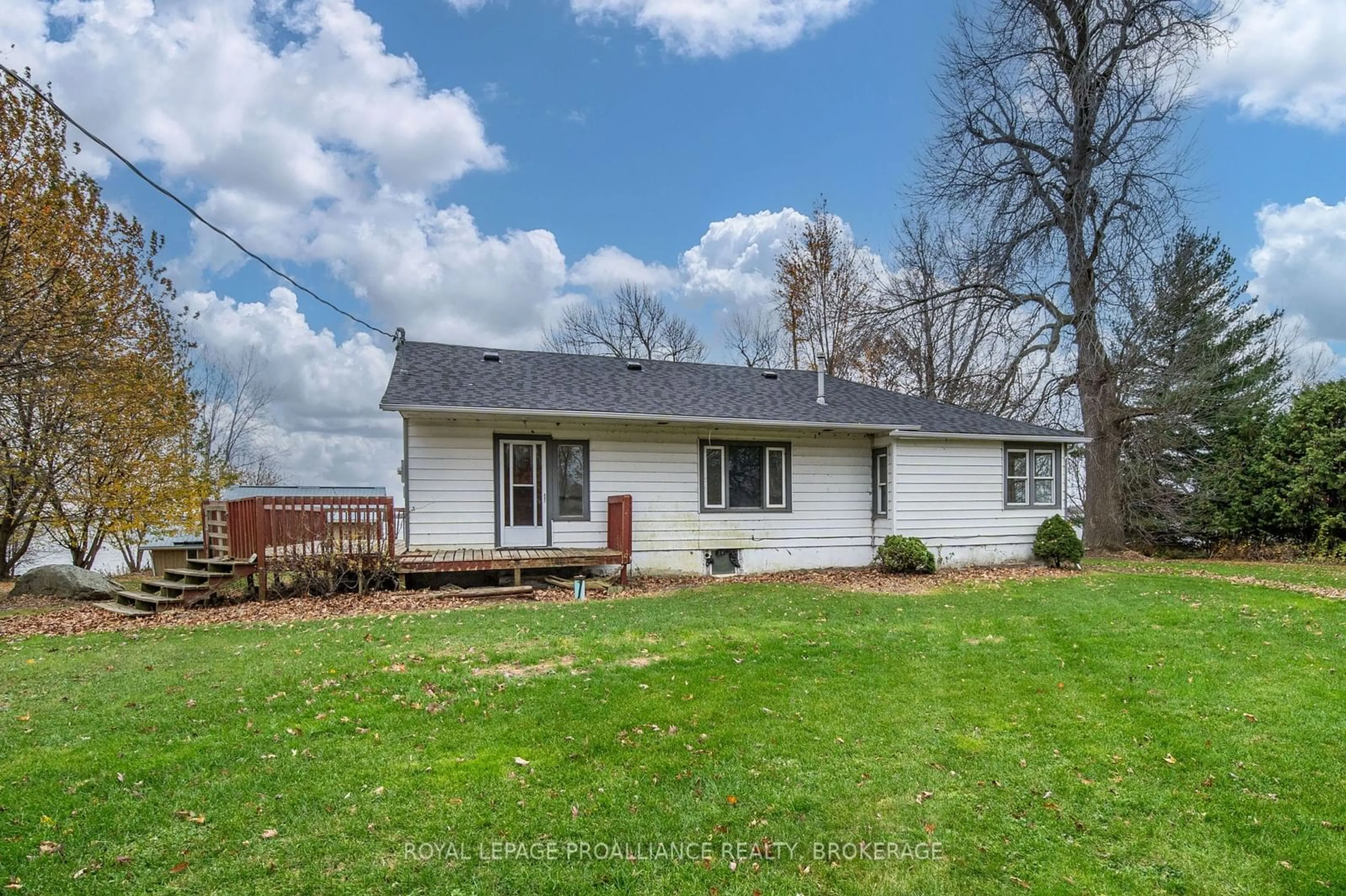 Frontside or backside of a home, the fenced backyard for 217 Eleventh Line Rd, Frontenac Islands Ontario K0K 2Y0