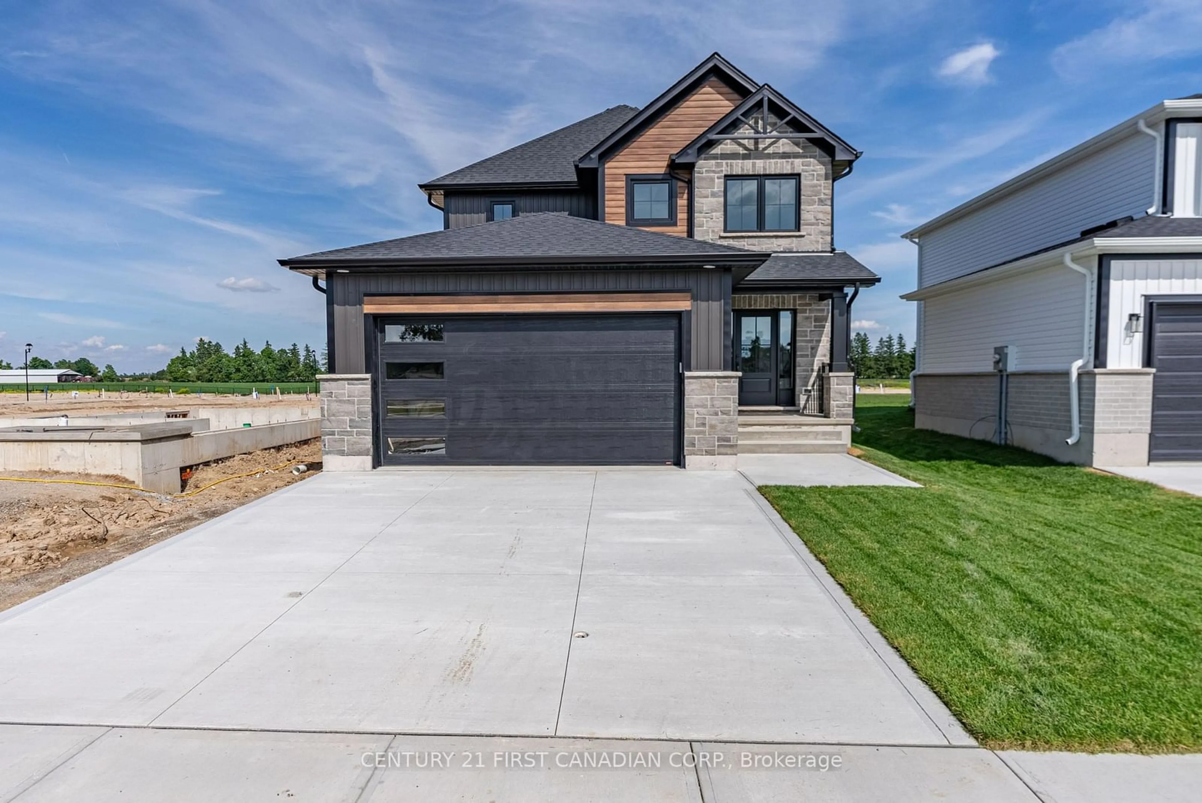 Frontside or backside of a home, the street view for 38 Postma Cres, North Middlesex Ontario N0M 1A0