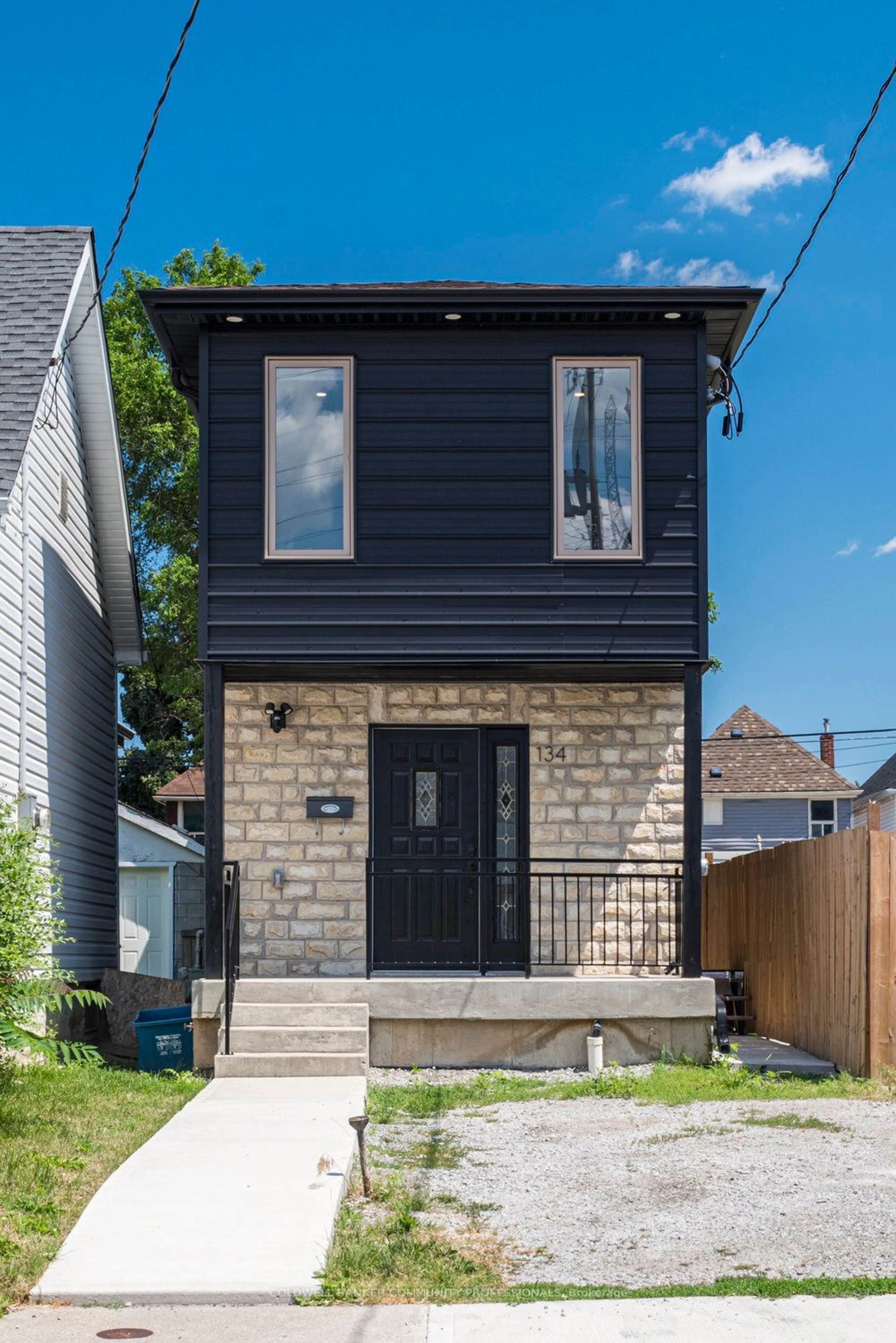 Frontside or backside of a home, the front or back of building for 134 Gibson Ave, Hamilton Ontario L8L 6J8