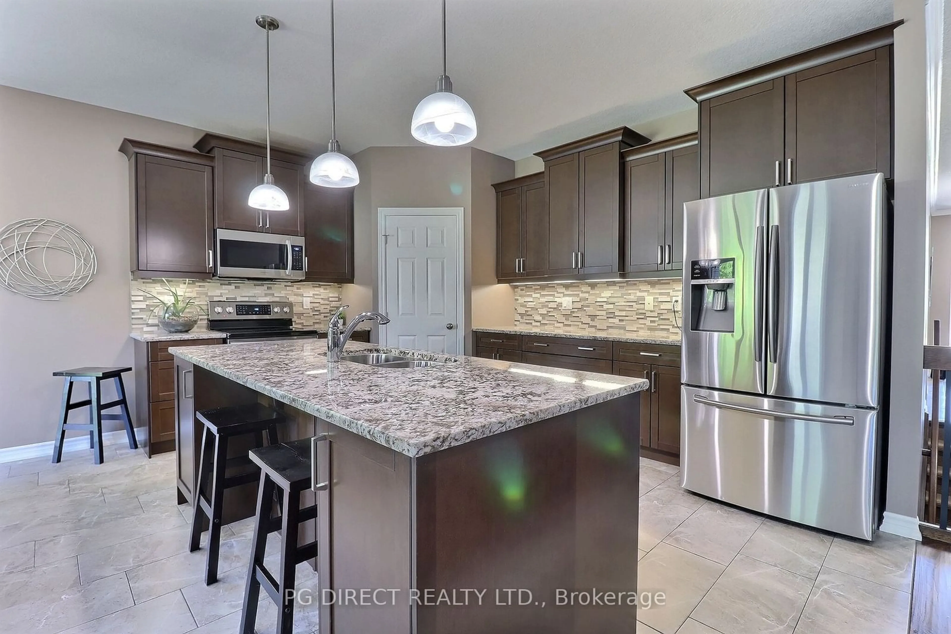 Open concept kitchen for 67 Caverhill Cres, Middlesex Centre Ontario N0L 1R0