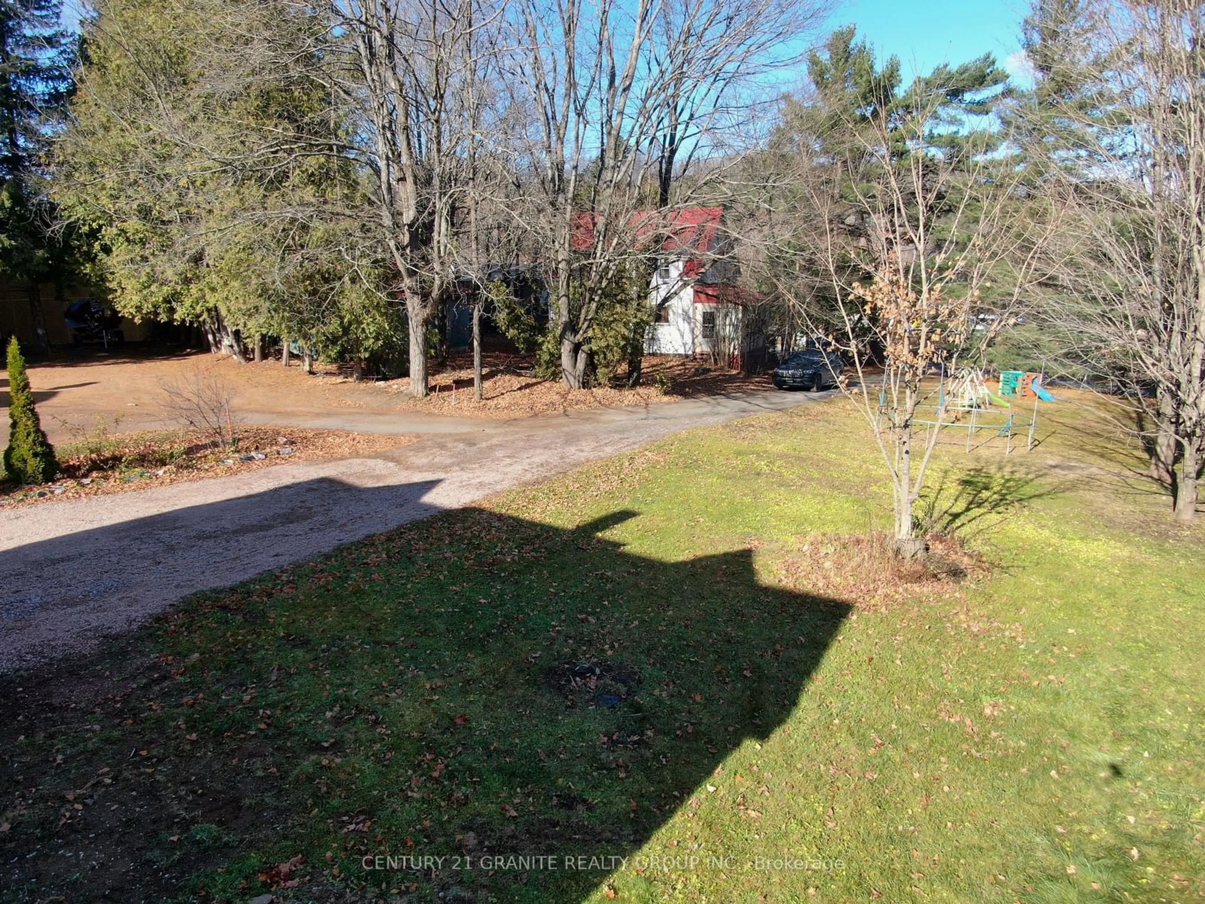 Frontside or backside of a home, the fenced backyard for 18 High School Lane, Bancroft Ontario K0L 1C0