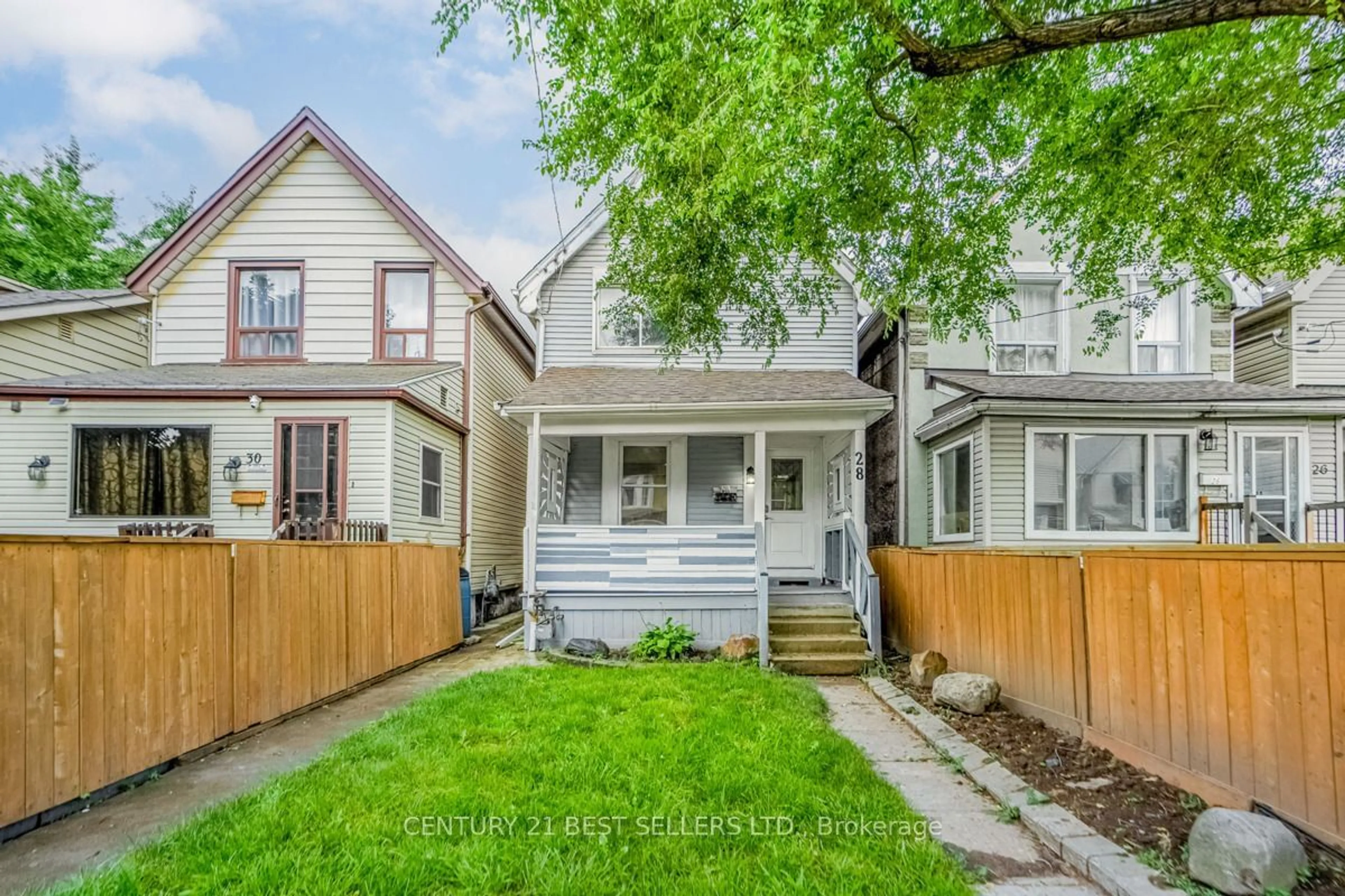 Frontside or backside of a home, the fenced backyard for 28 Francis St, Hamilton Ontario L8L 3V1