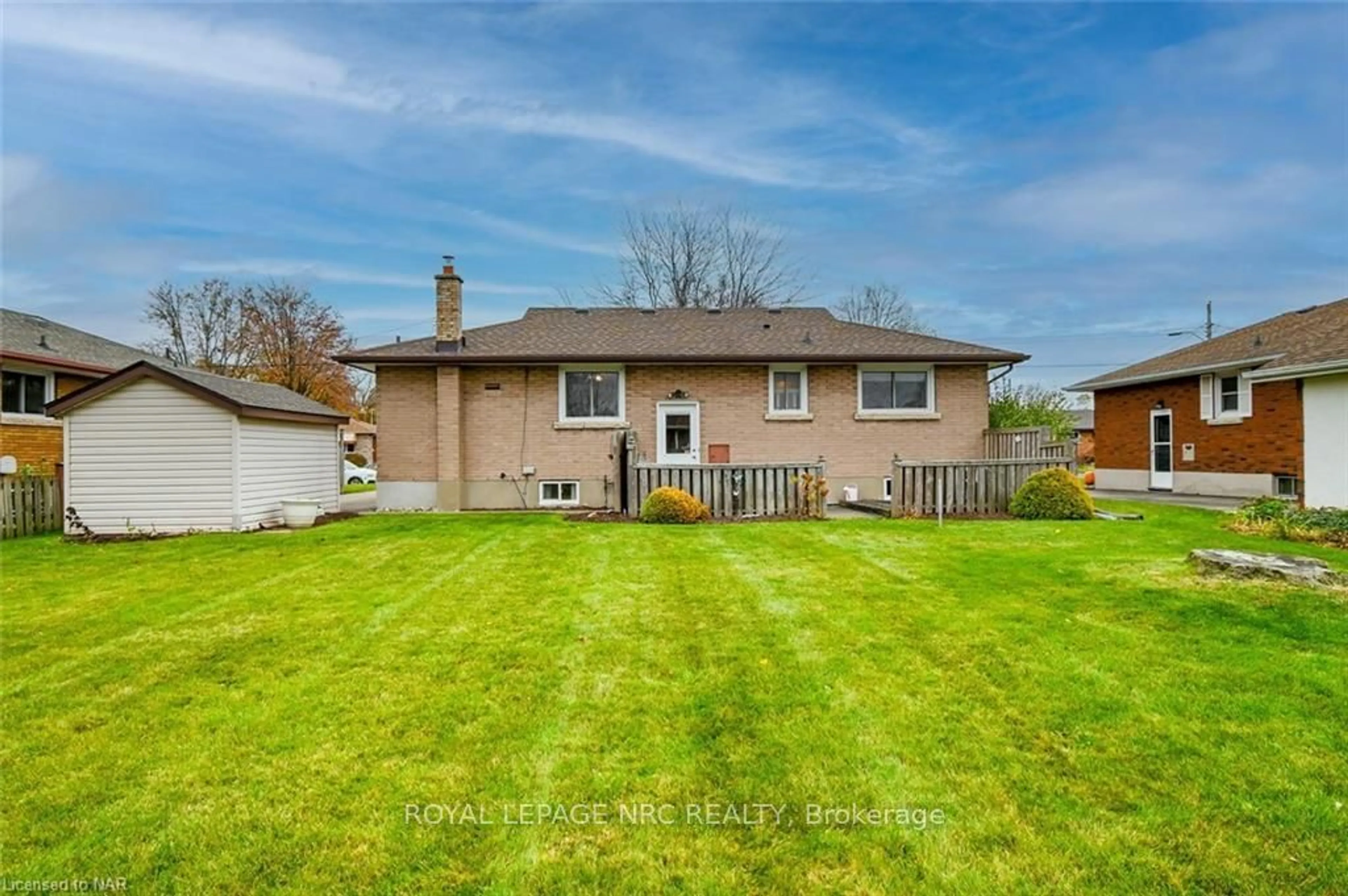 Frontside or backside of a home, the fenced backyard for 535 ALAN Ave, Welland Ontario L3C 2Y8