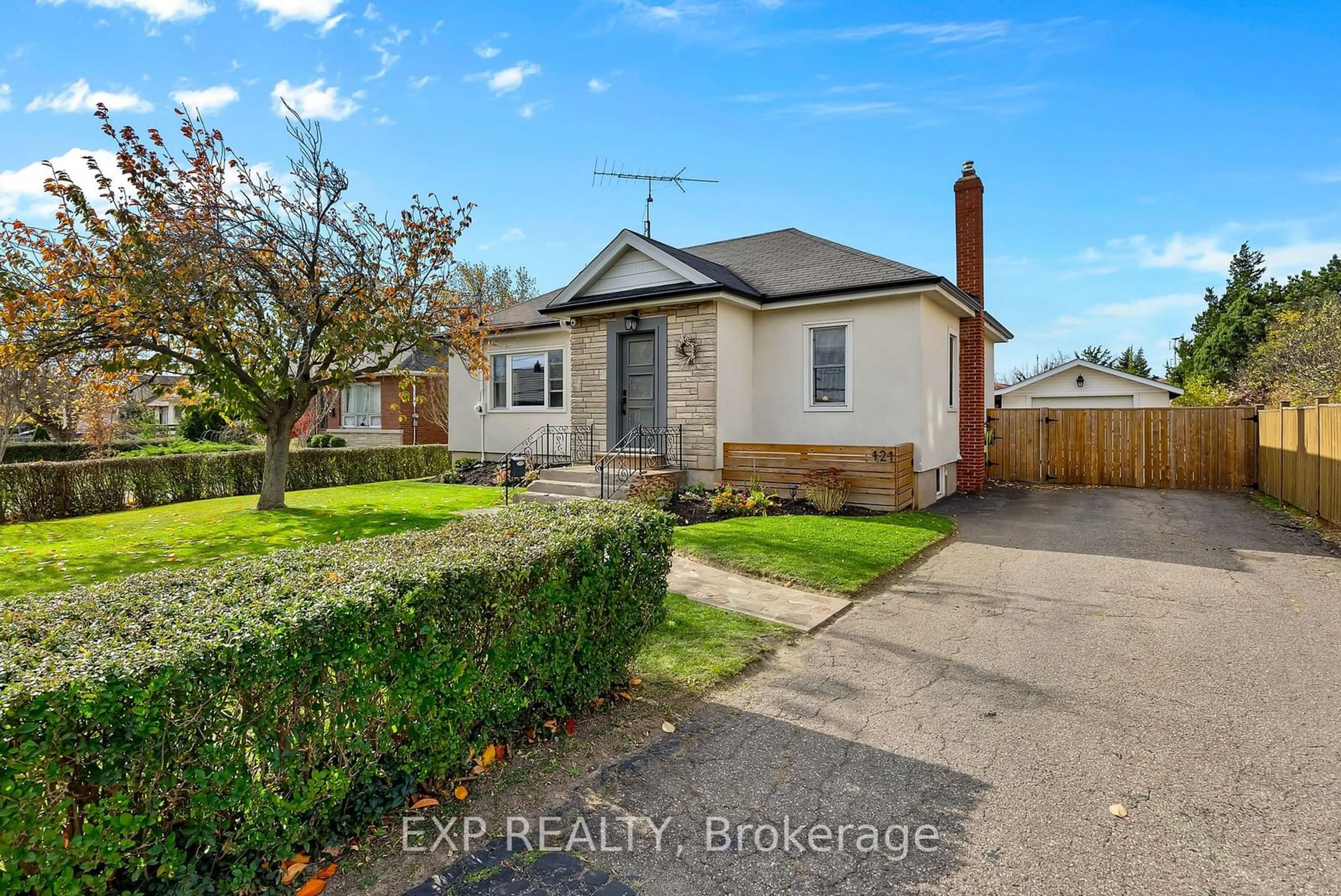 Frontside or backside of a home, the fenced backyard for 121 Louth St, St. Catharines Ontario L2S 2T8