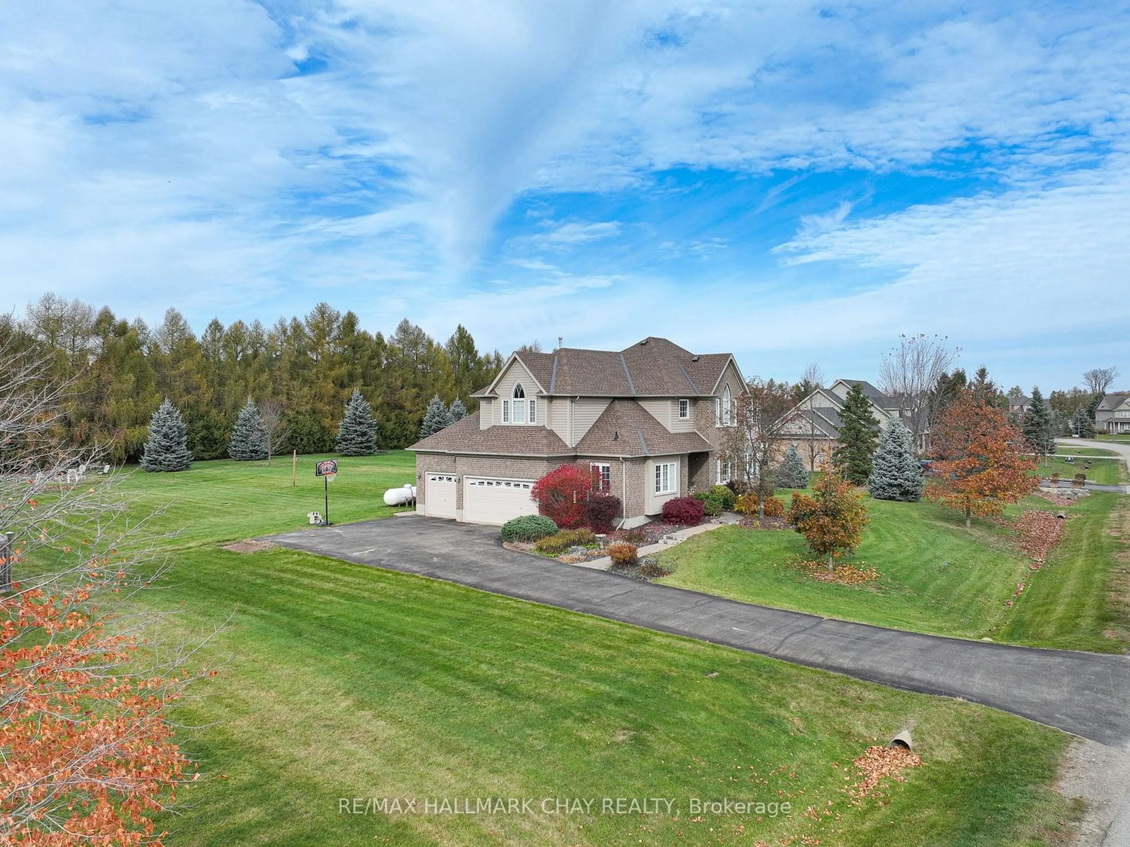 Frontside or backside of a home, the fenced backyard for 18 Thomson Tr, Mulmur Ontario L9V 3J1