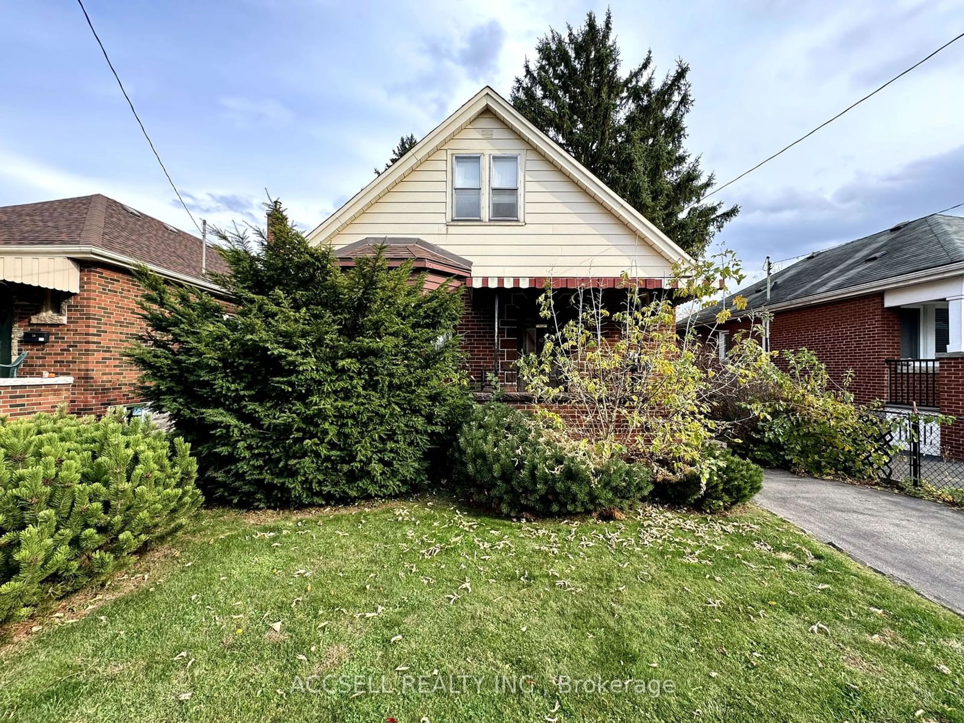 Frontside or backside of a home, the street view for 41 Cameron Ave, Hamilton Ontario L8K 2X1