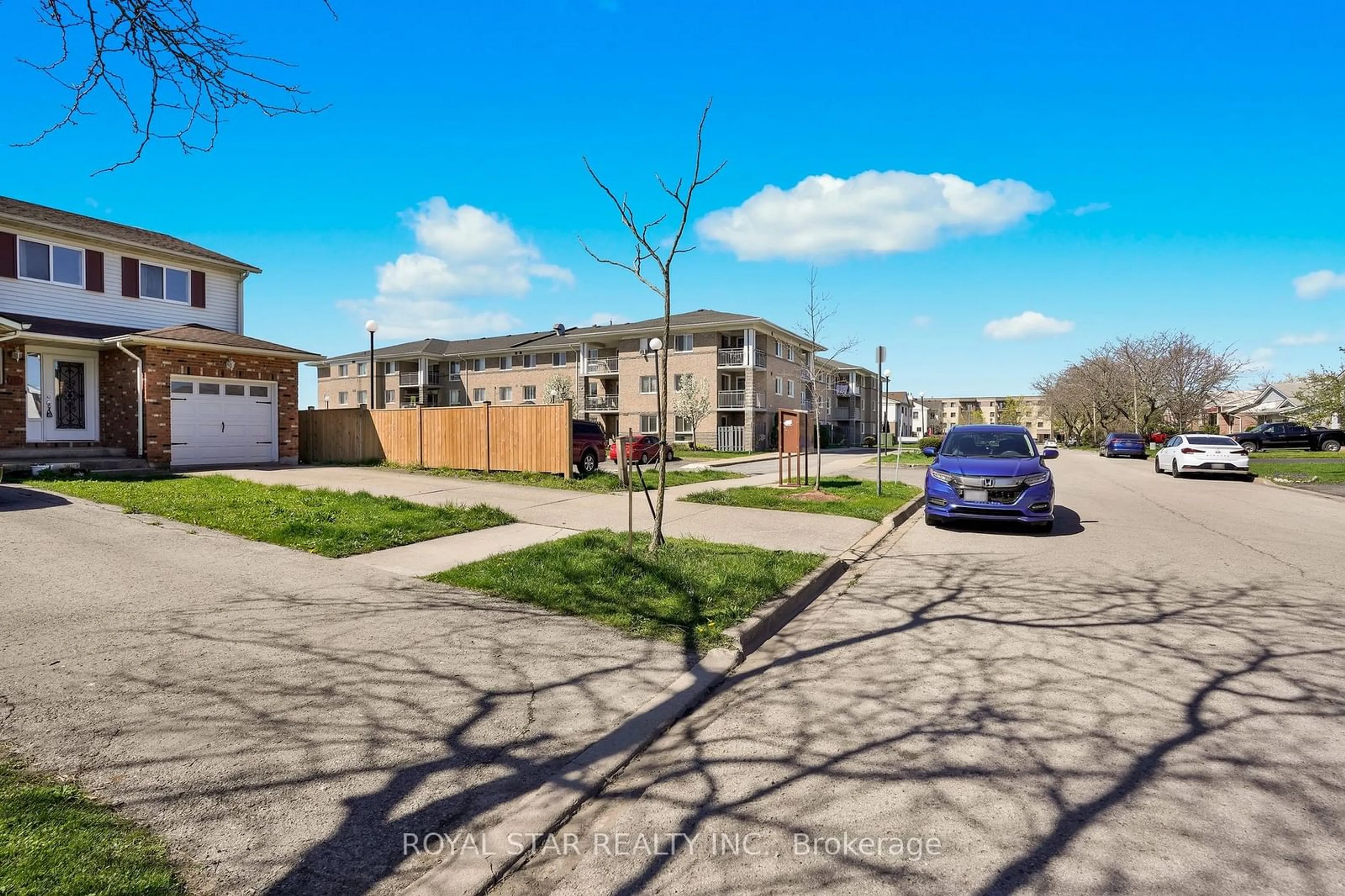 A pic from exterior of the house or condo, the fenced backyard for 19 Barnaby Dr, St. Catharines Ontario L2S 3C7