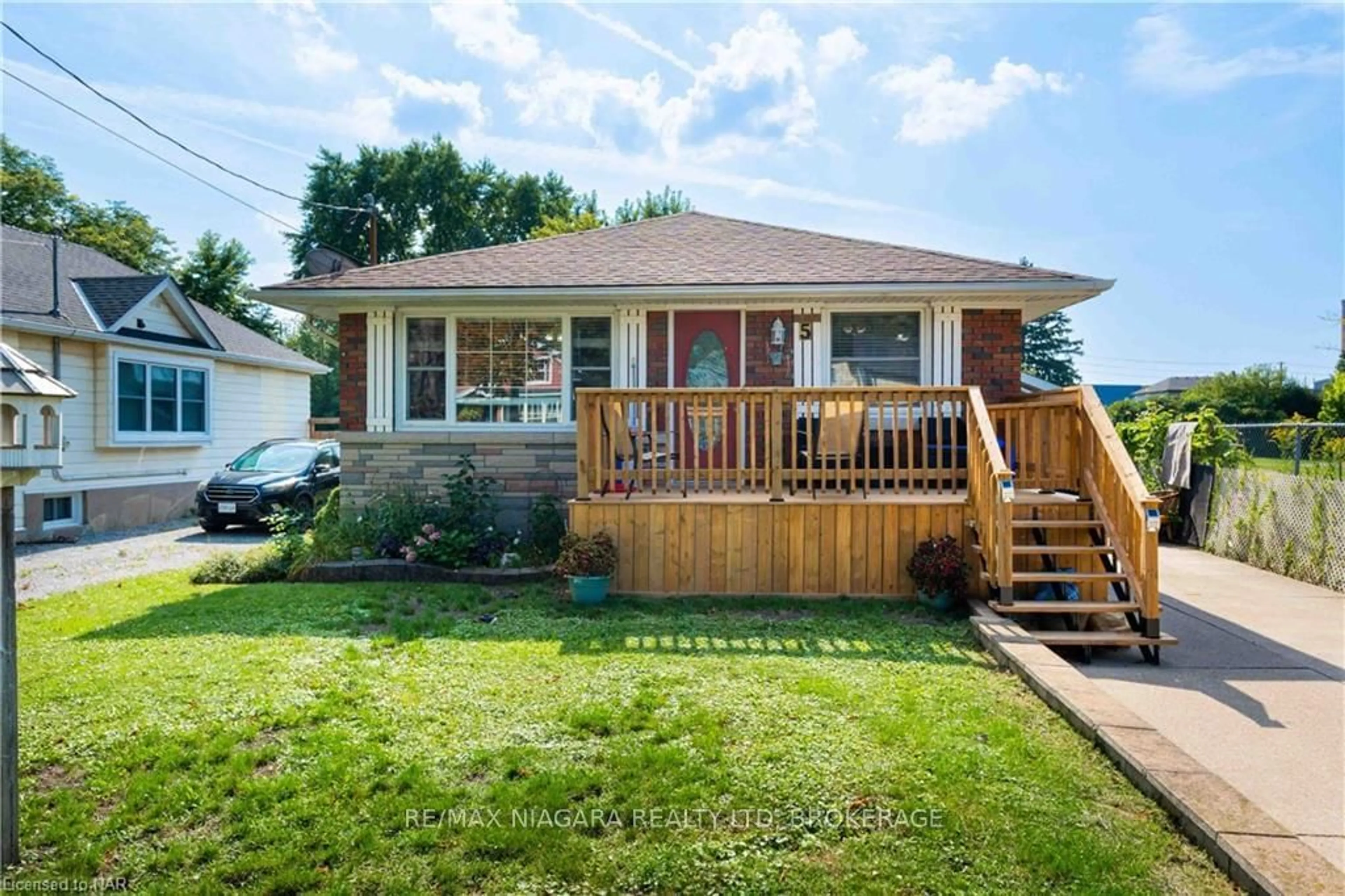 Frontside or backside of a home, the fenced backyard for 5 ST PETER St, St. Catharines Ontario L2T 1N7