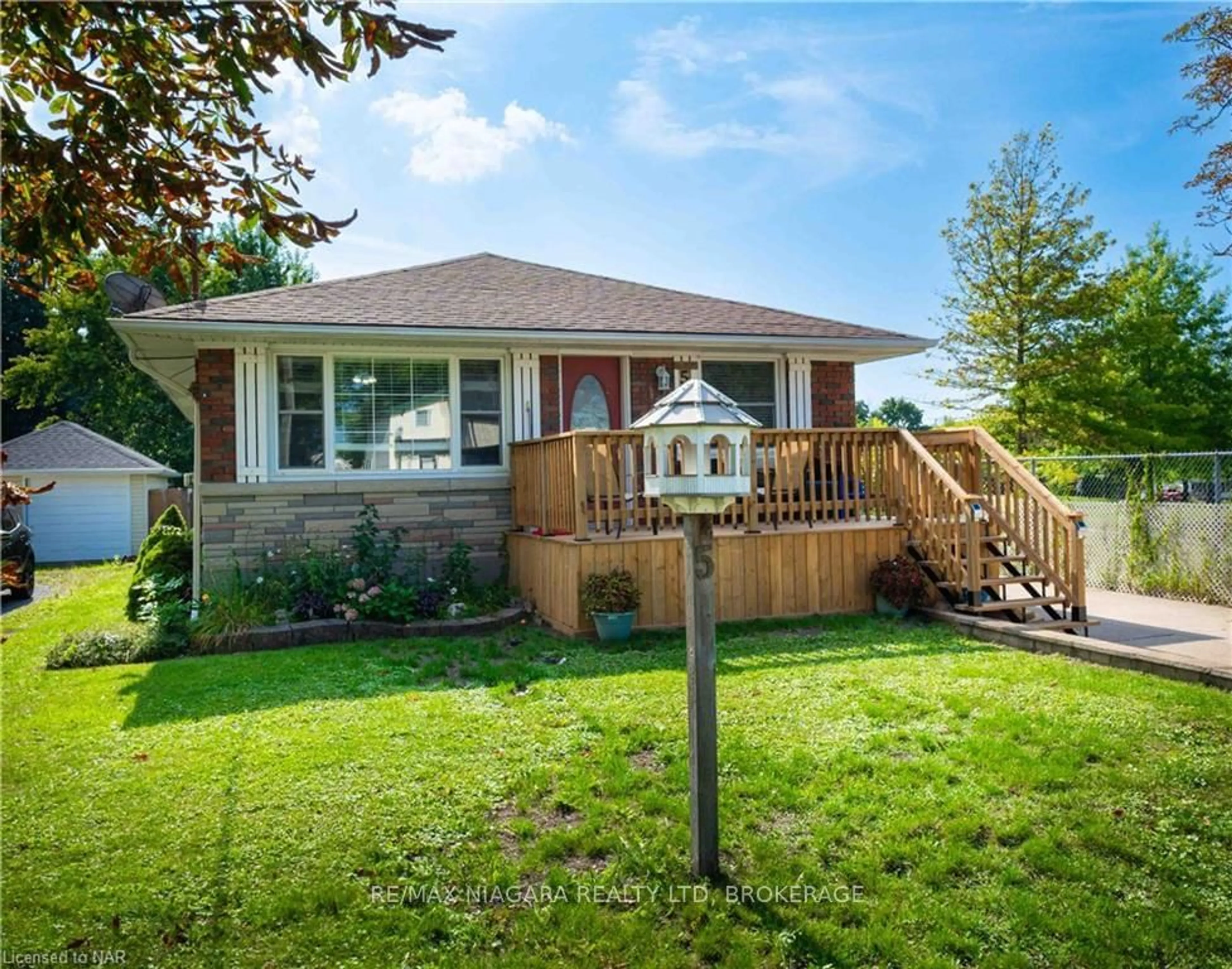 Frontside or backside of a home, the fenced backyard for 5 ST PETER St, St. Catharines Ontario L2T 1N7