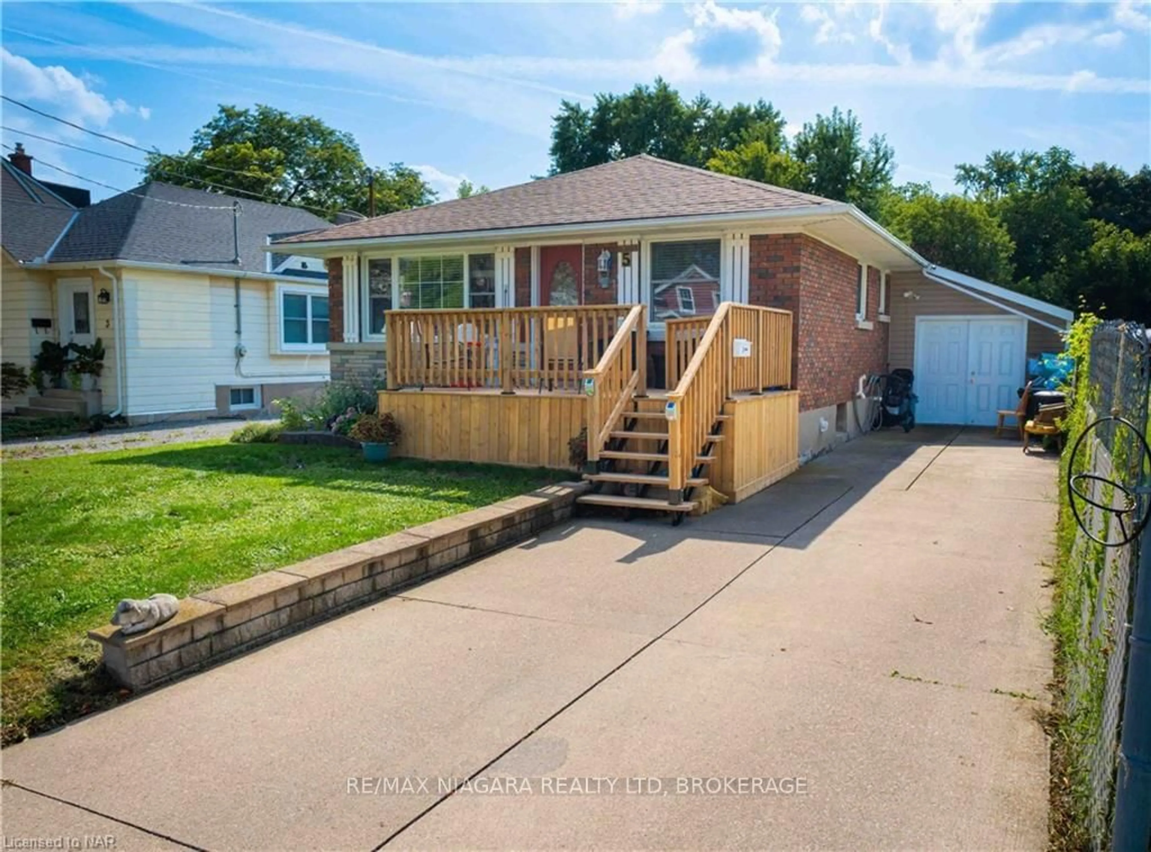 Frontside or backside of a home, the fenced backyard for 5 ST PETER St, St. Catharines Ontario L2T 1N7