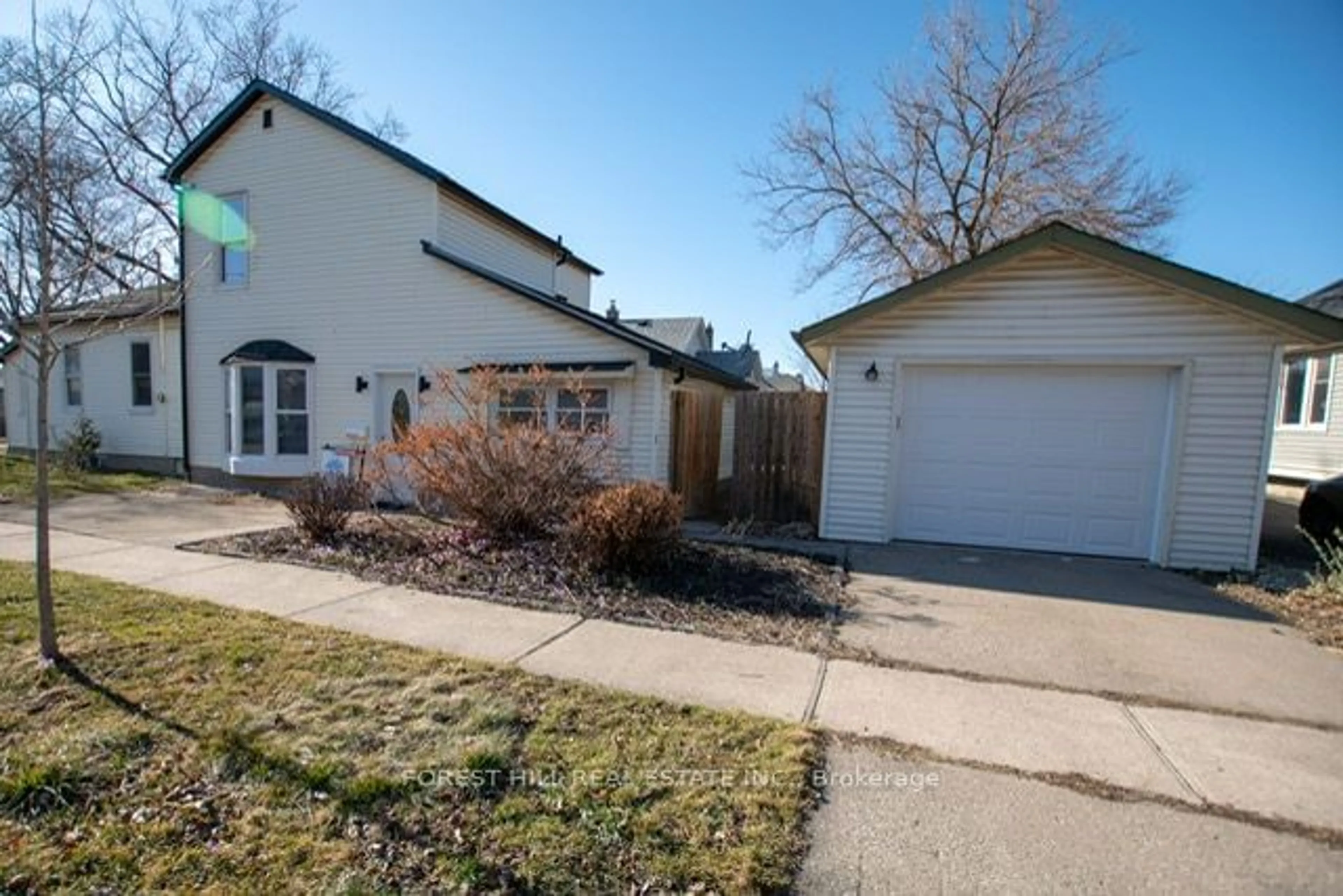 A pic from exterior of the house or condo, the fenced backyard for 16 Dexter St, St. Catharines Ontario L2S 2L6