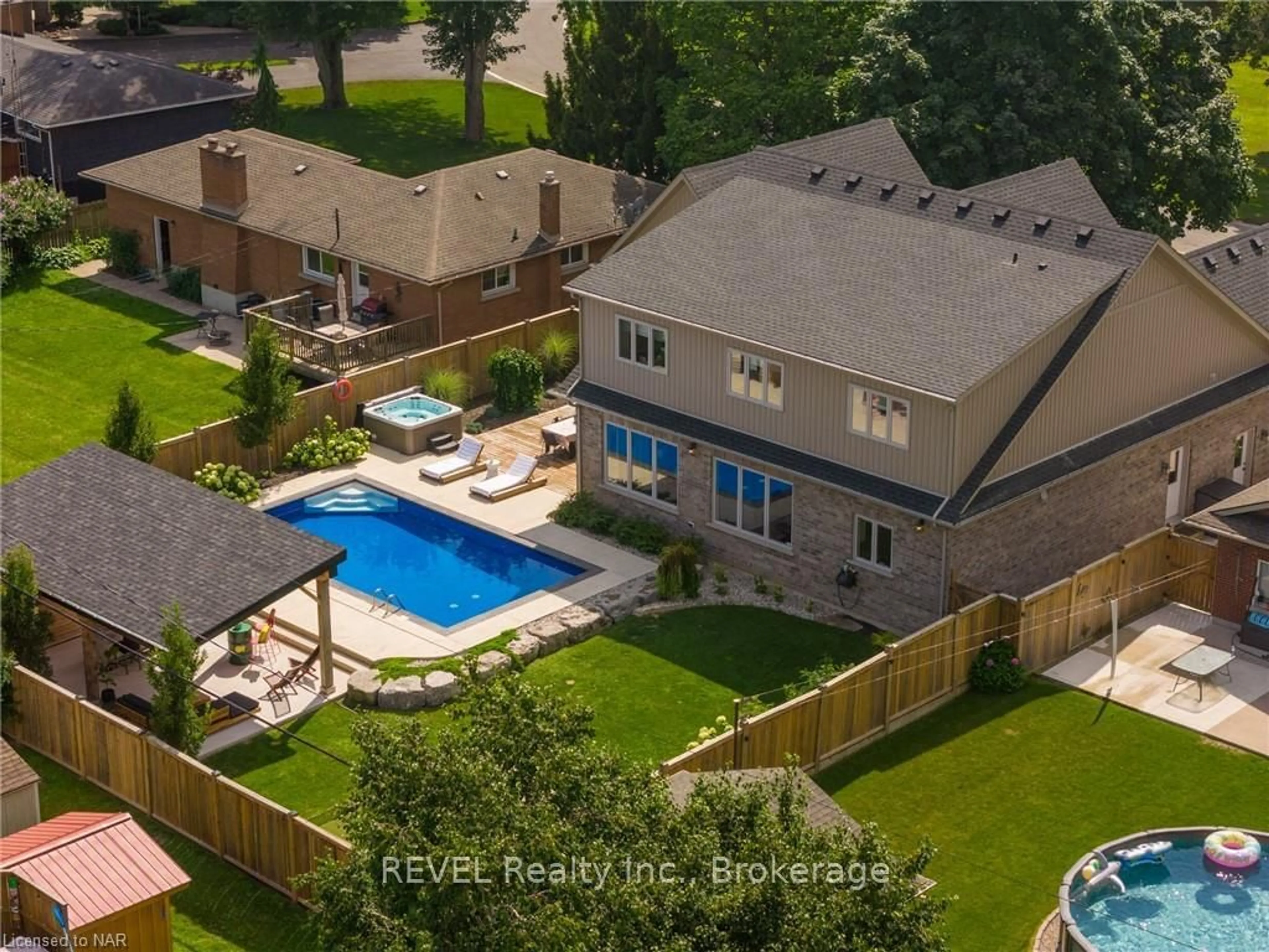 Frontside or backside of a home, the fenced backyard for 8 RUNNYMEDE Rd, Port Colborne Ontario L3K 5C1