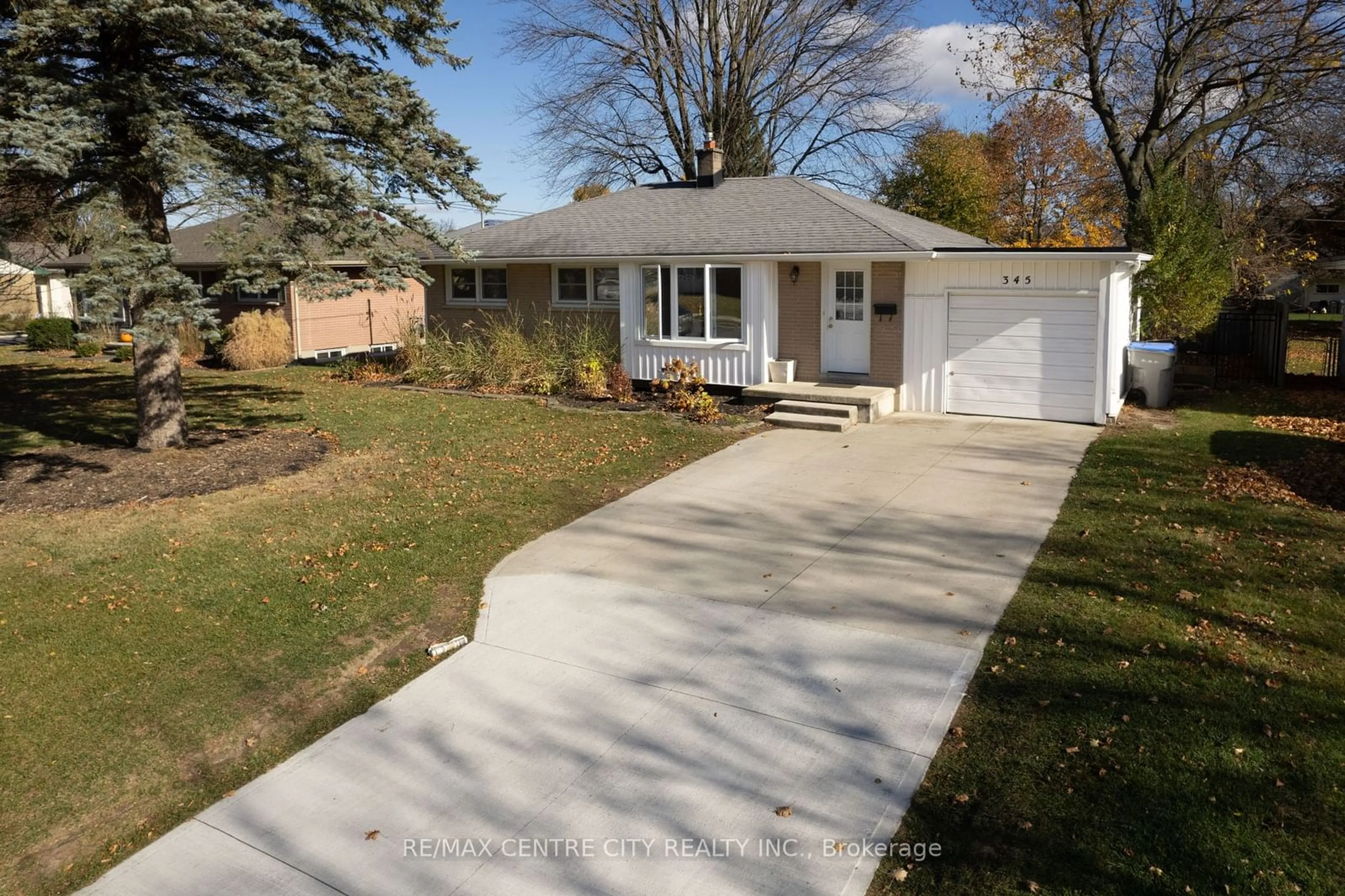 Frontside or backside of a home, the fenced backyard for 345 Drury Lane, Strathroy-Caradoc Ontario N7G 3E8