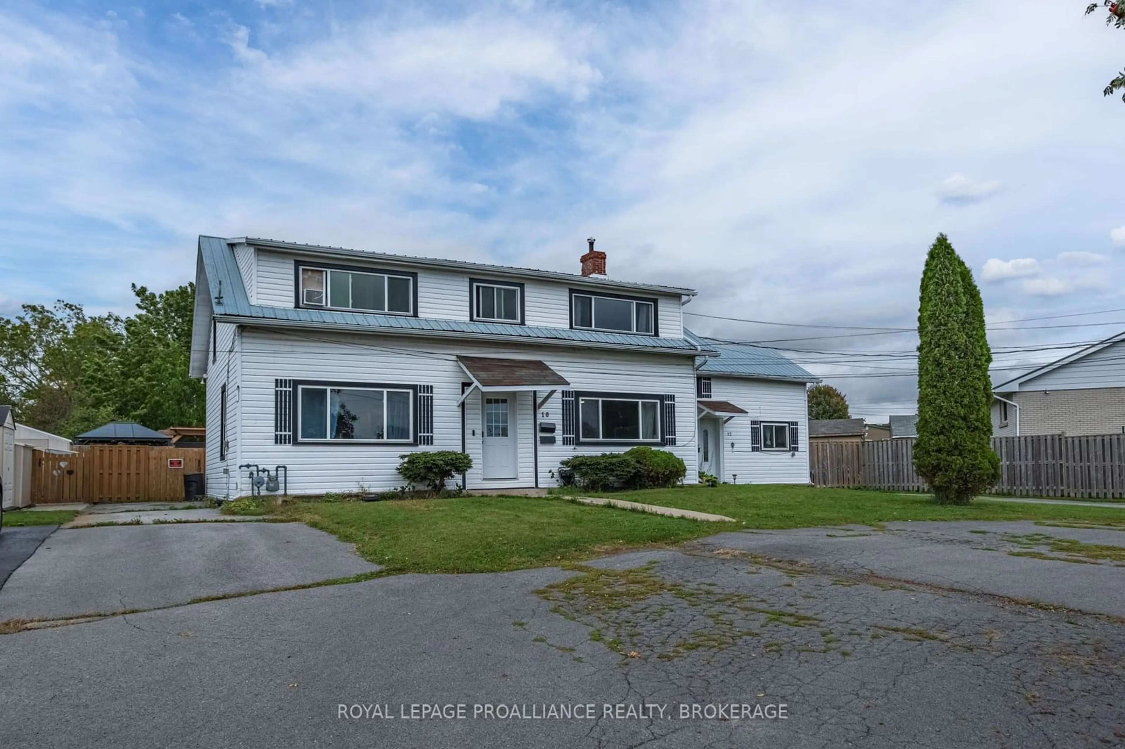 Frontside or backside of a home, the street view for 10-12 Manitou Cres, Loyalist Ontario K7N 1B6